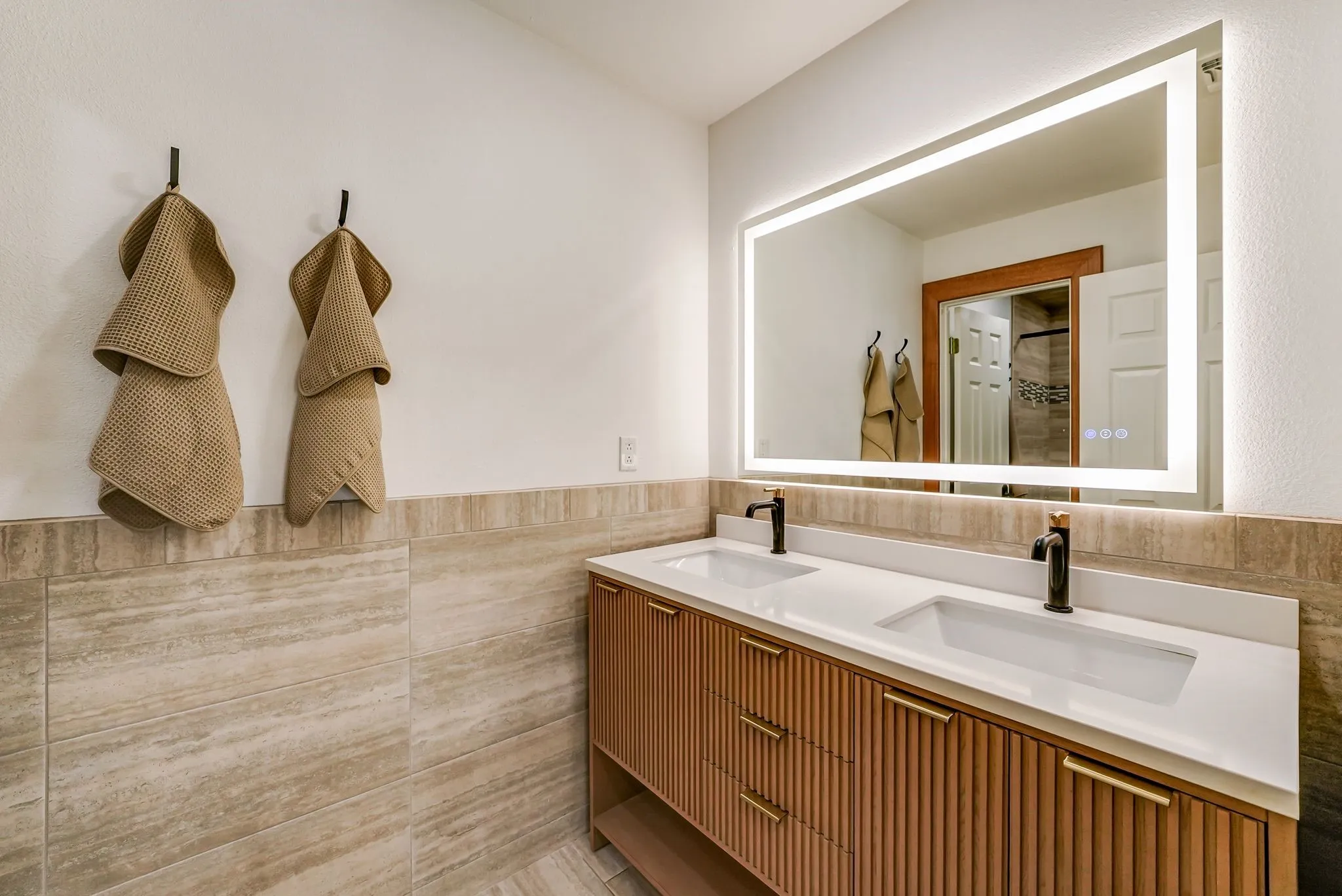 Full Bathroom #3 on second floor. Dual vanity with white countertops and matte black faucets