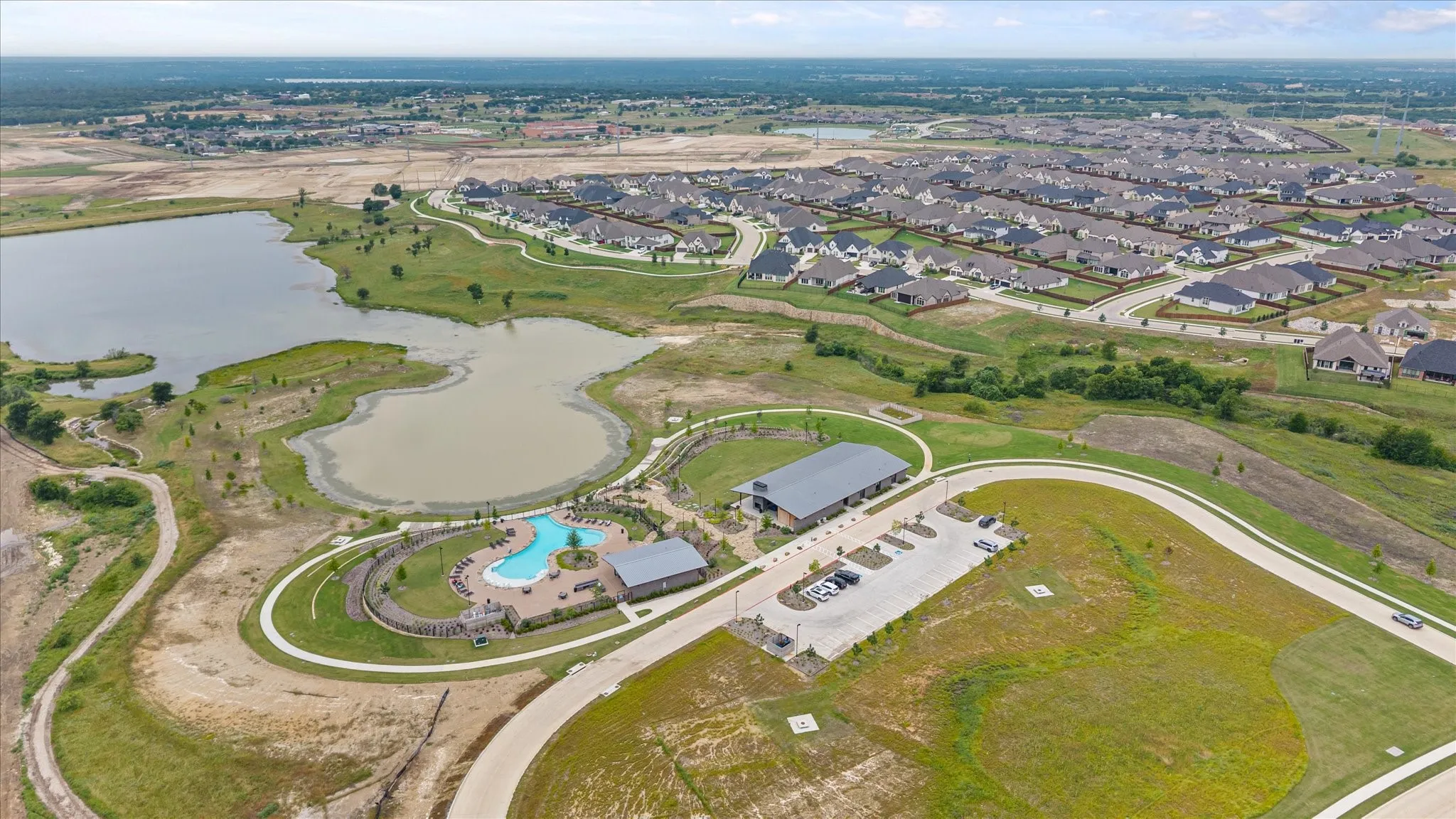 Aerial perspective showcasing a residential community with numerous homes