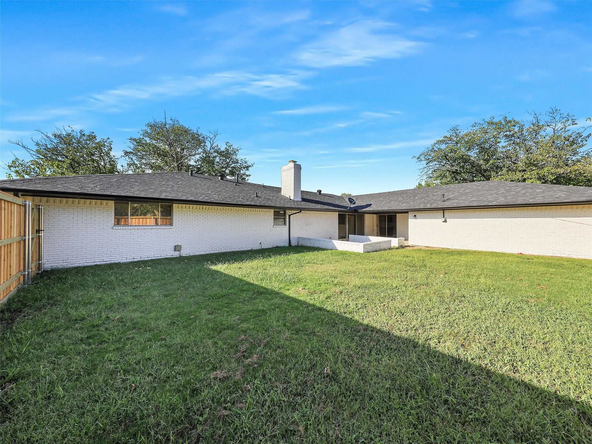 Large fenced backyard provides plenty of room for pets, play, gardening, or future outdoor enhancements.