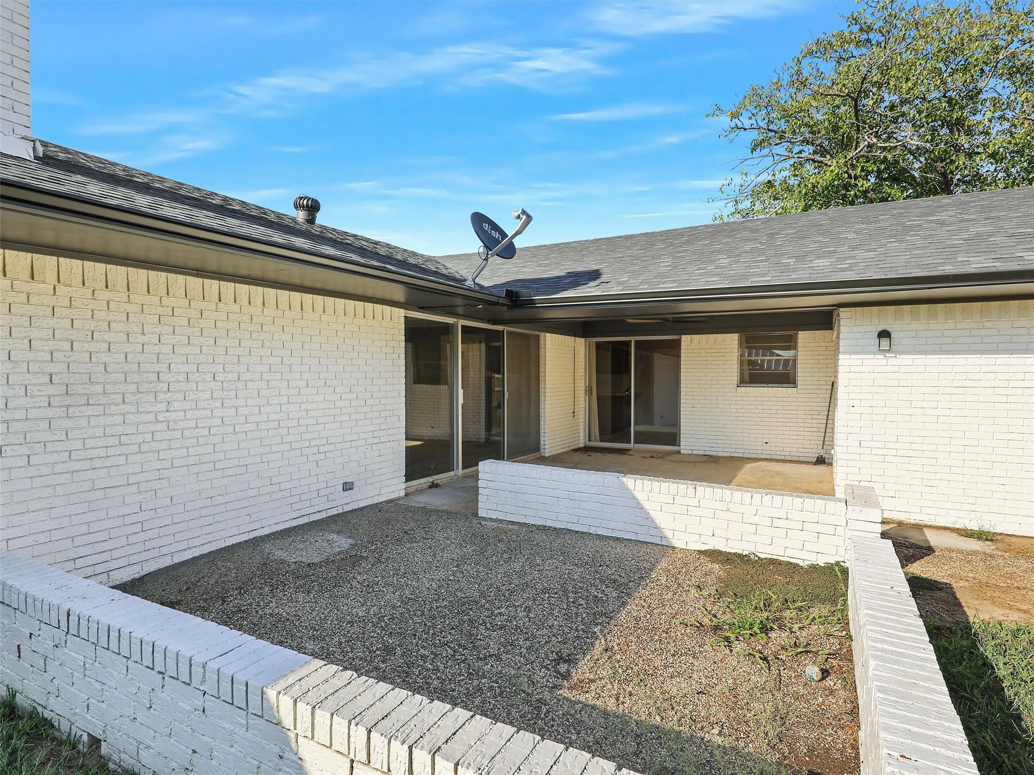 Unique covered courtyard patio offering a secluded outdoor living space with direct access from multiple rooms of the home.