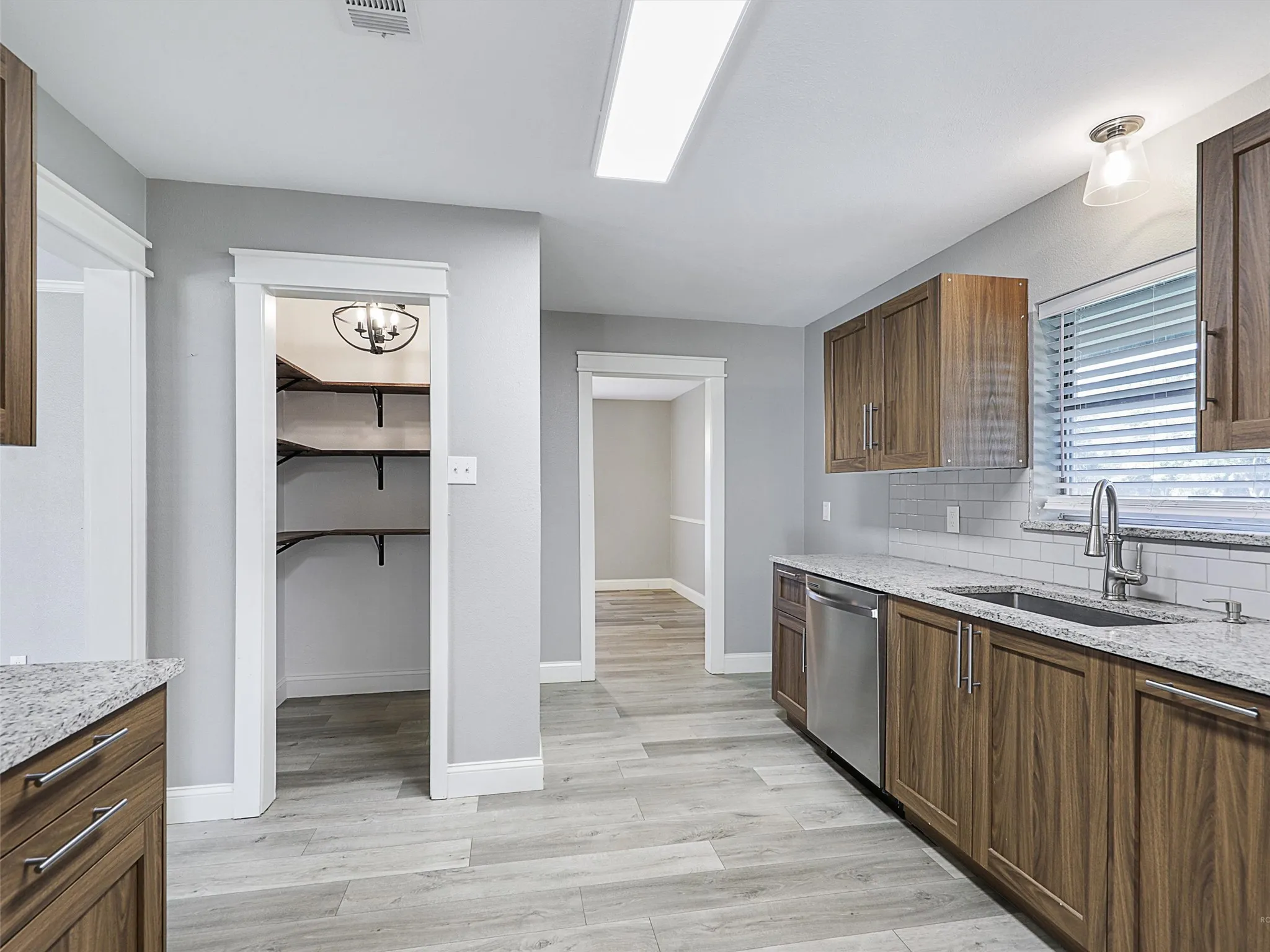 Enjoy exceptional storage with a spacious walk-in pantry and abundant cabinet space to keep everything organized and within reach.