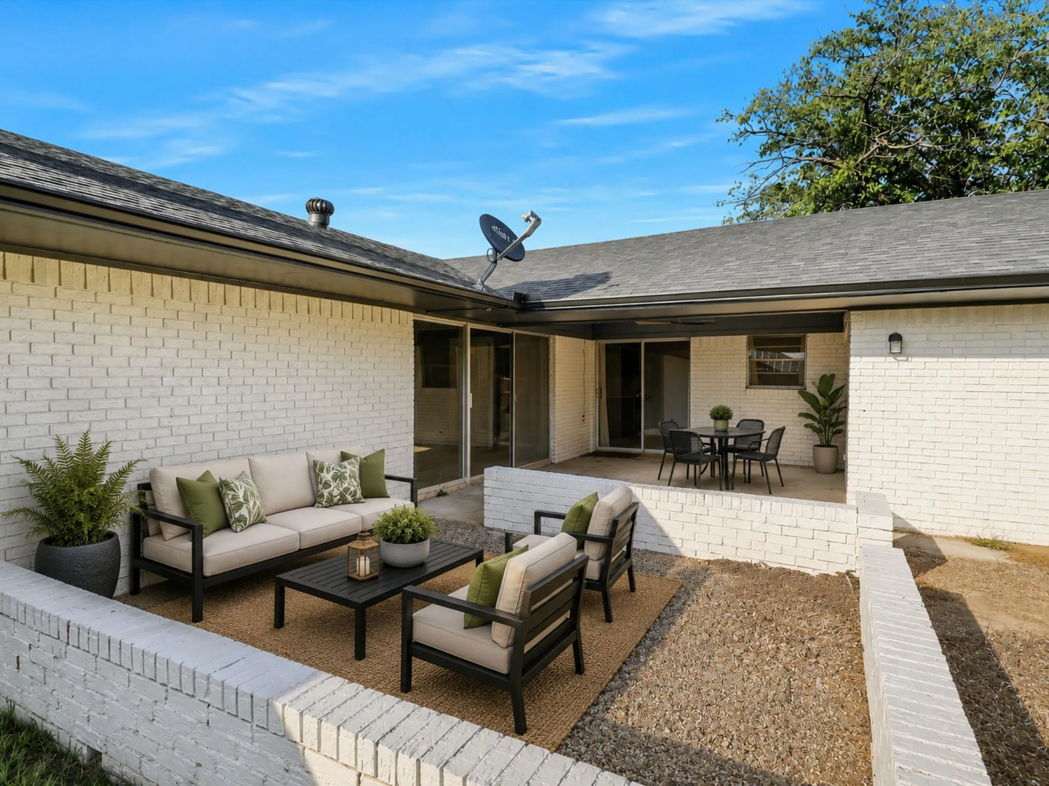 Private courtyard-style patio creates the perfect setting for outdoor dining, morning coffee, or relaxing with friends.