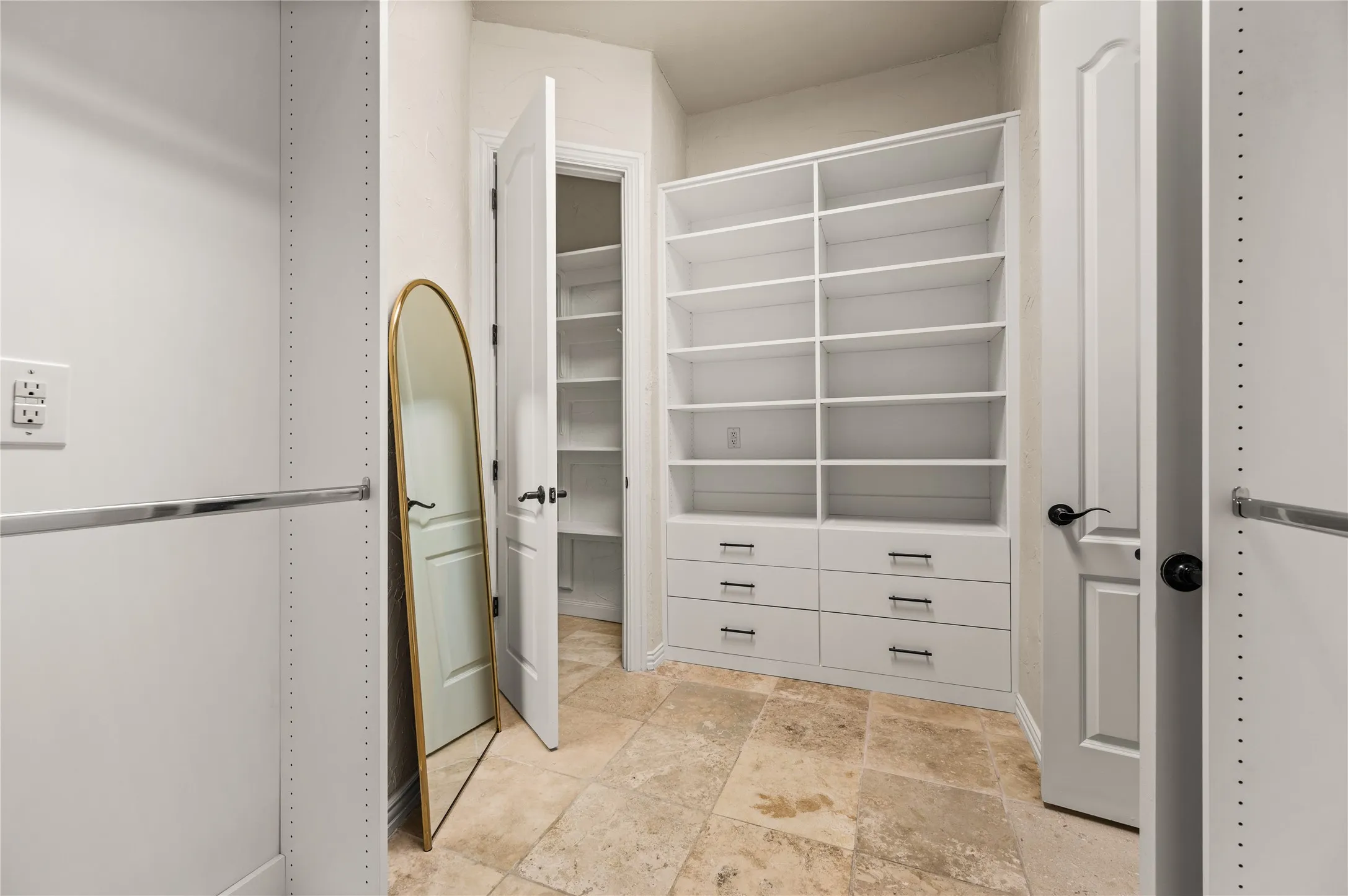 Customized closet system just installed by Closets by Design, plus additional linen/storage closet with a door