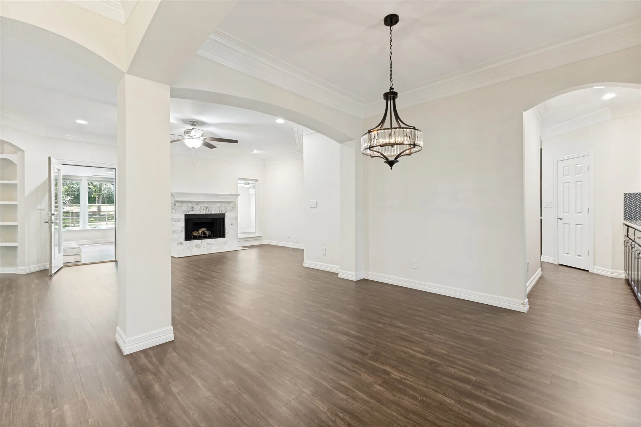 Beautiful architectural designs in the stunning dining room and living room with one of three fireplaces!