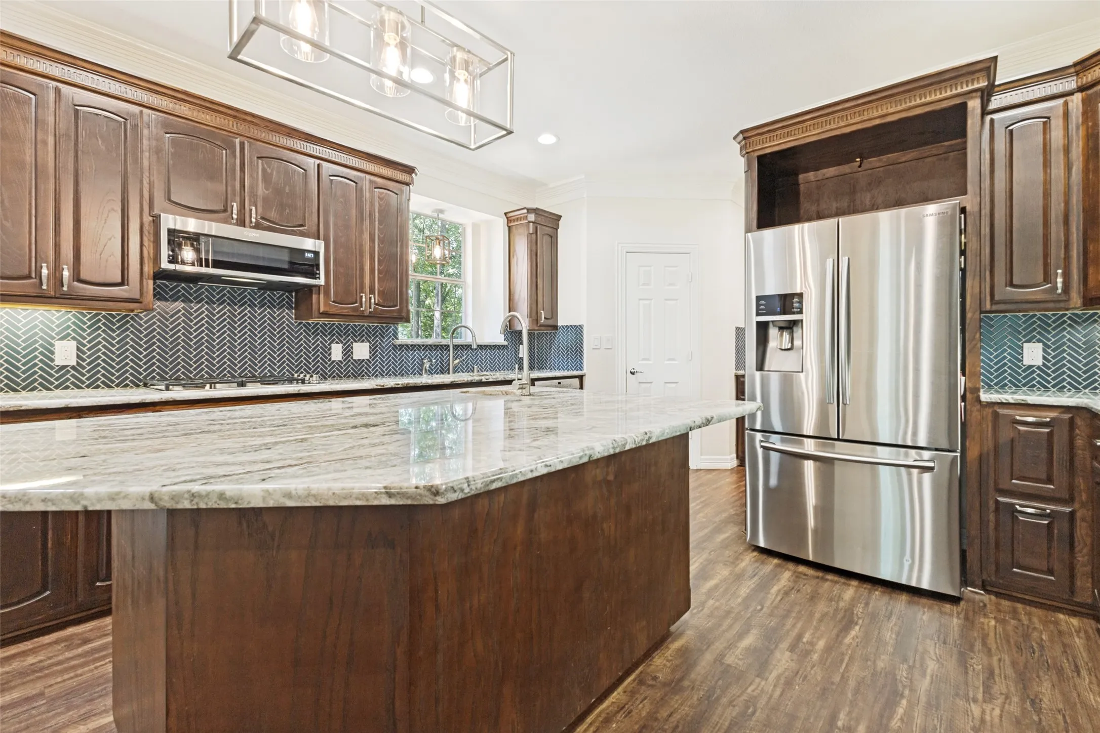 Stainless Steel refrigerator stays PLUS a wine fridge in the center island!