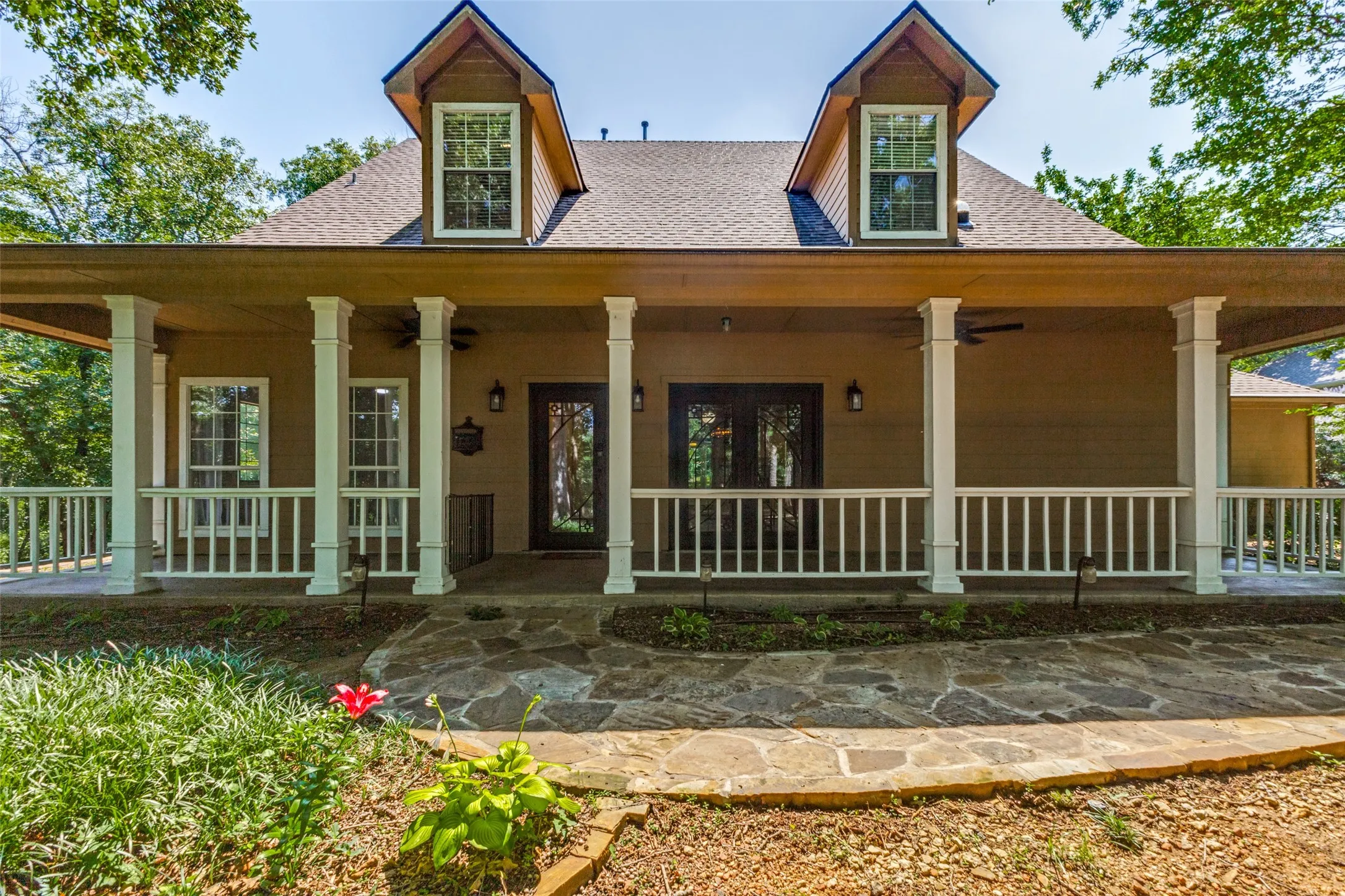 More lush landscaping as you walk up the flagstone walkway!