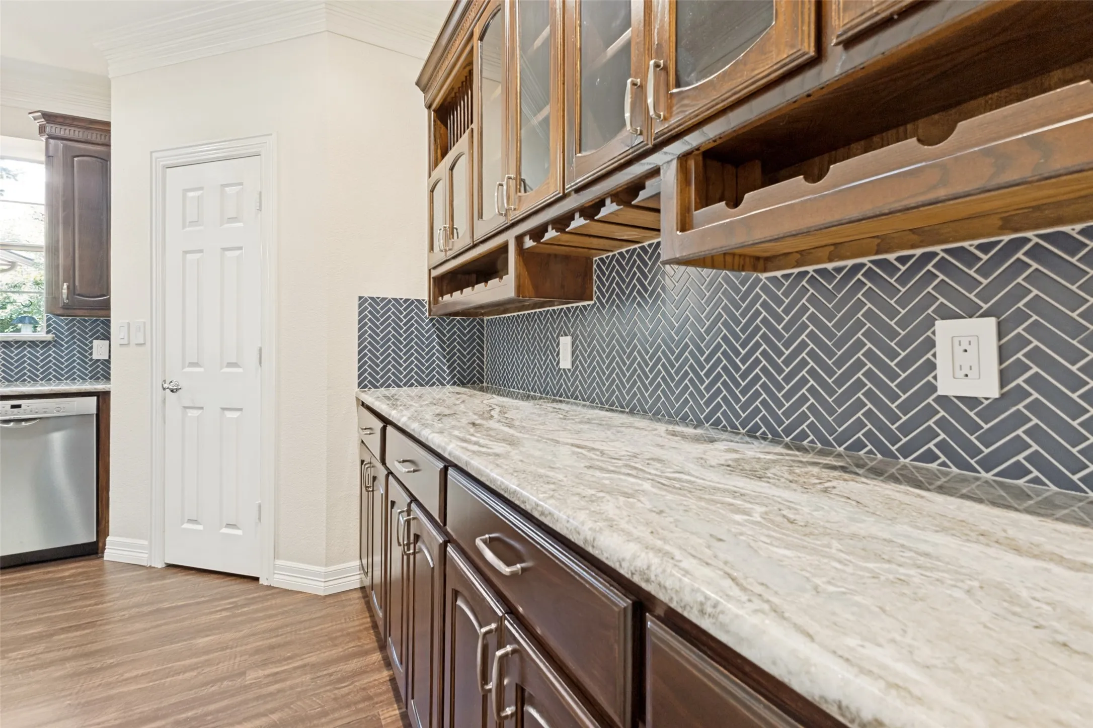 A huge butler's pantry with so much storage and gorgeous granite.
