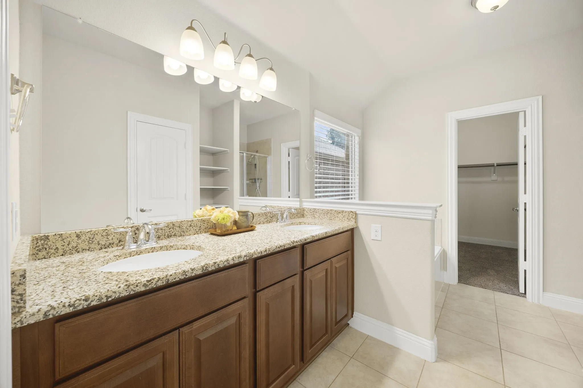 Granite counters and fashionable lighting.