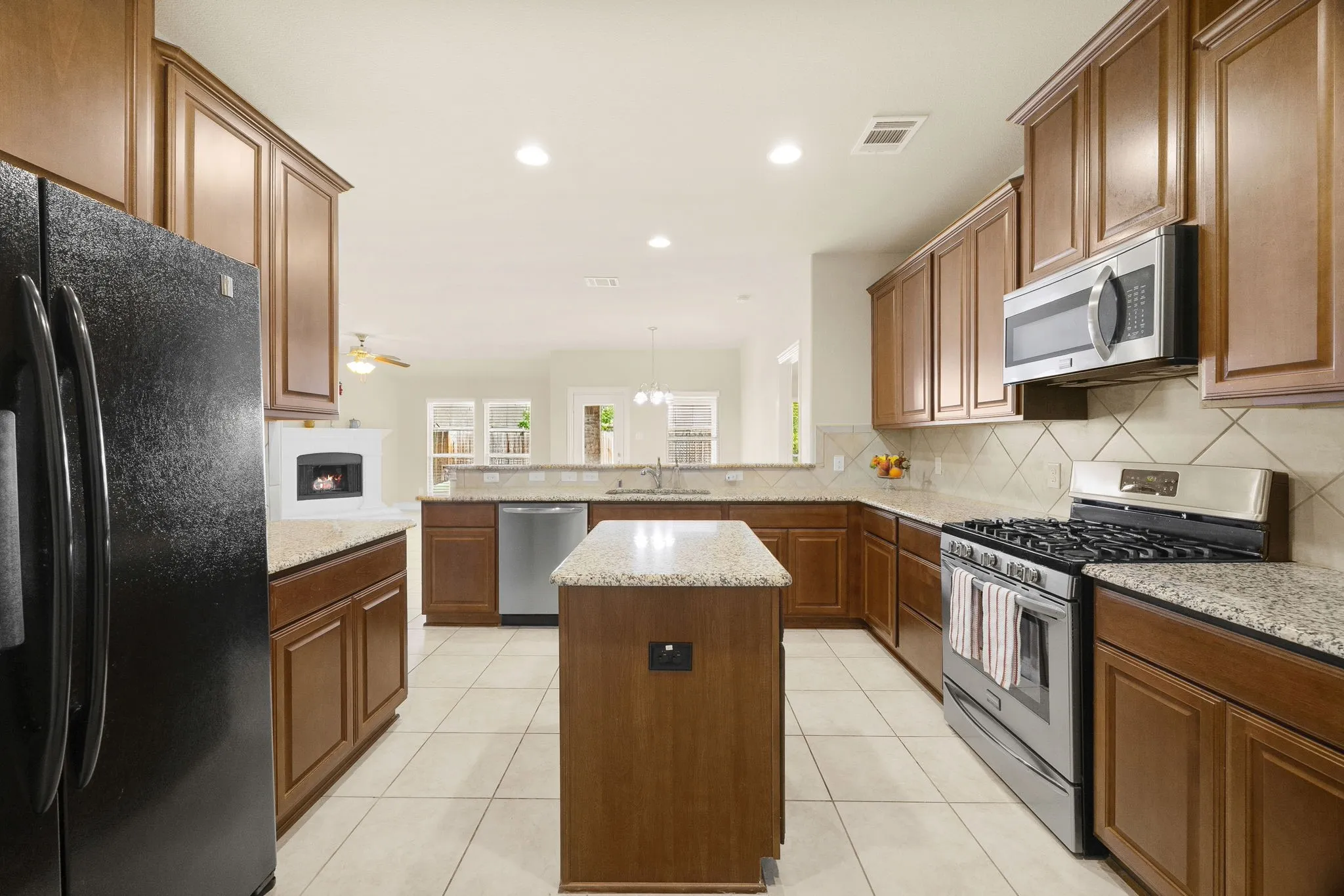 Granite counter tops and stainless steel appliances.