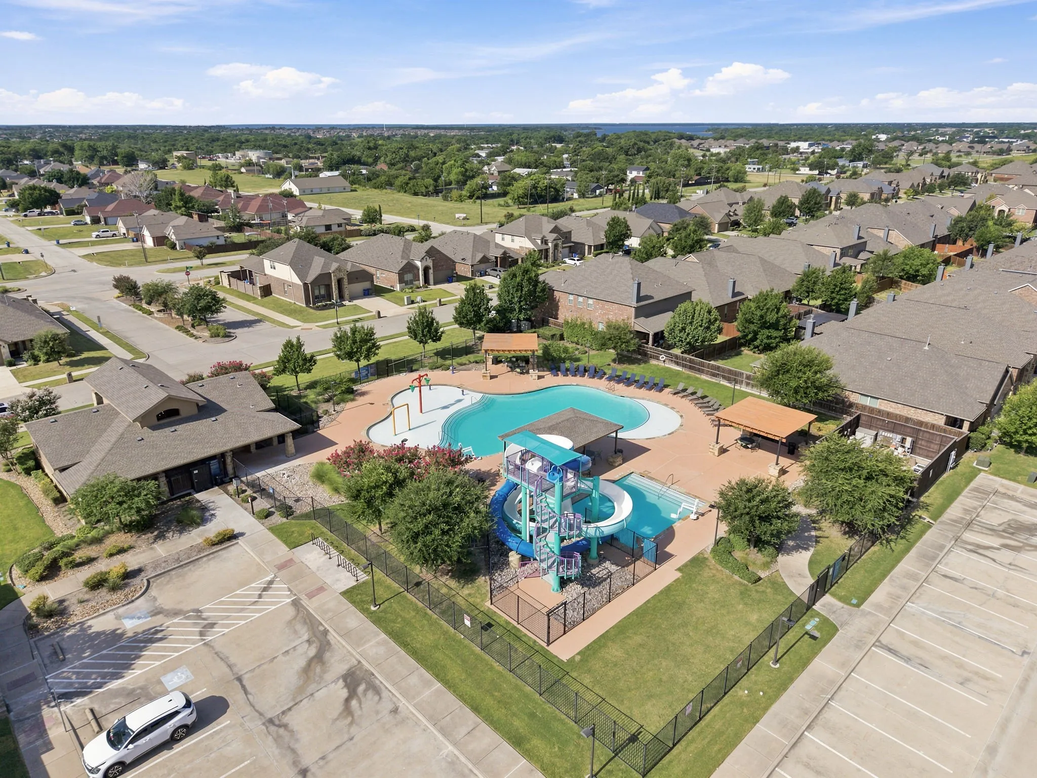 Community pool with splash pad and slide.