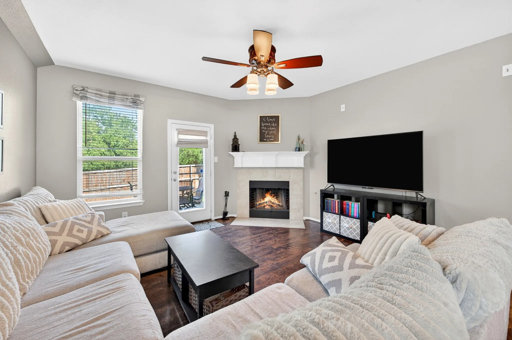 Living area featuring wood-finish flooring and light gray walls