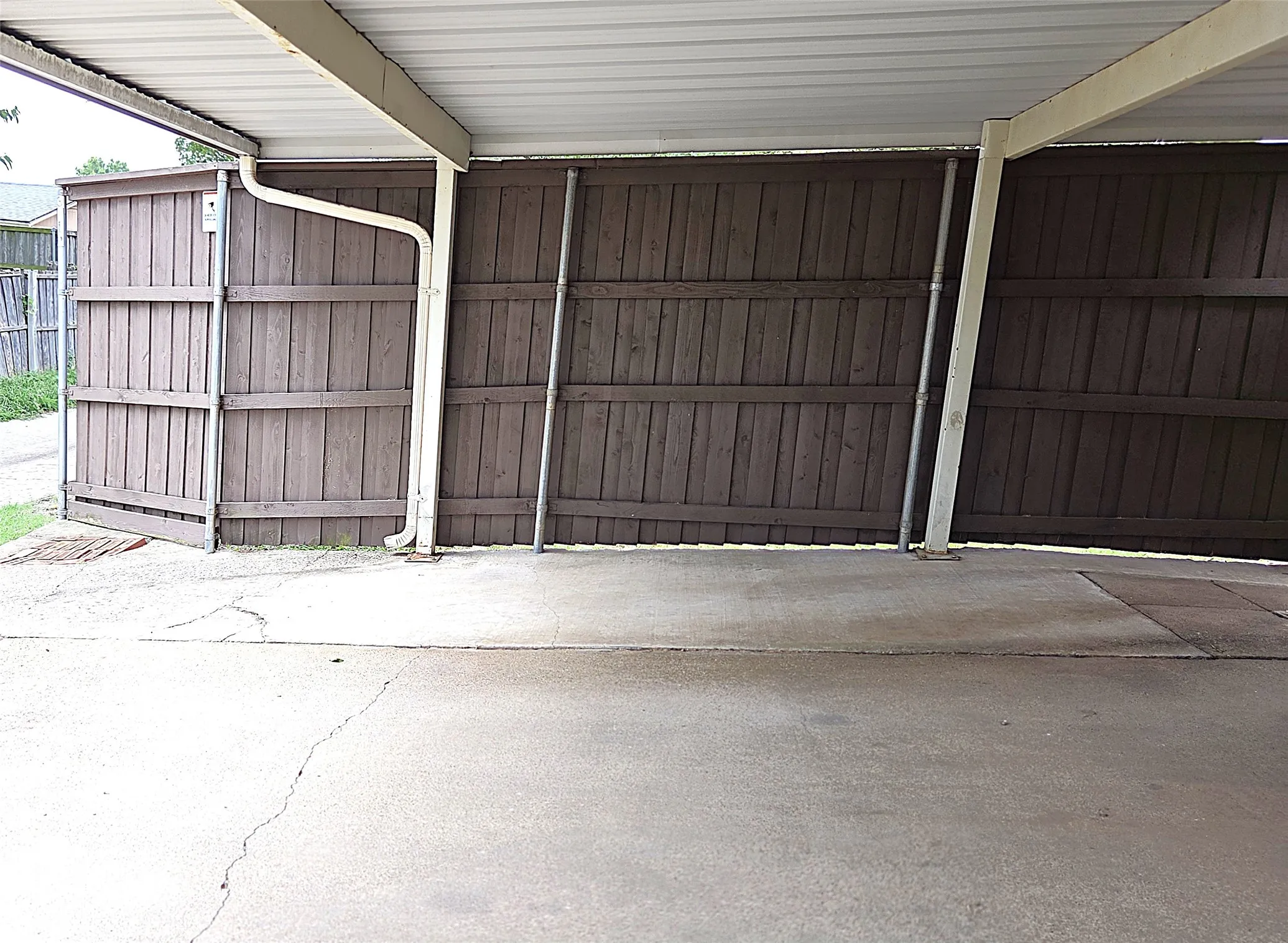 8ft board on board privacy fence with reinforced metal poles.