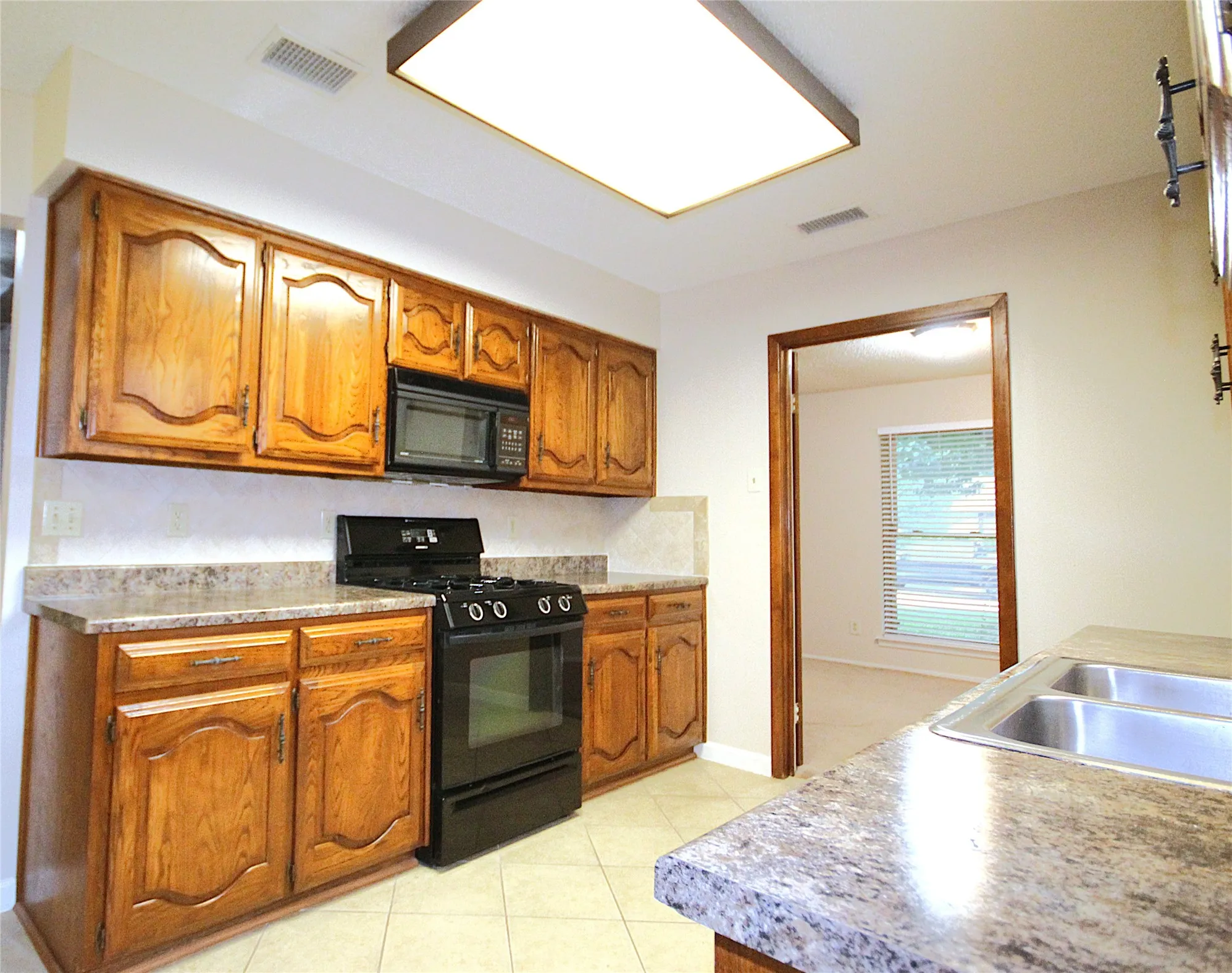 Kitchen and access to optional formal dining, study or additional living area.