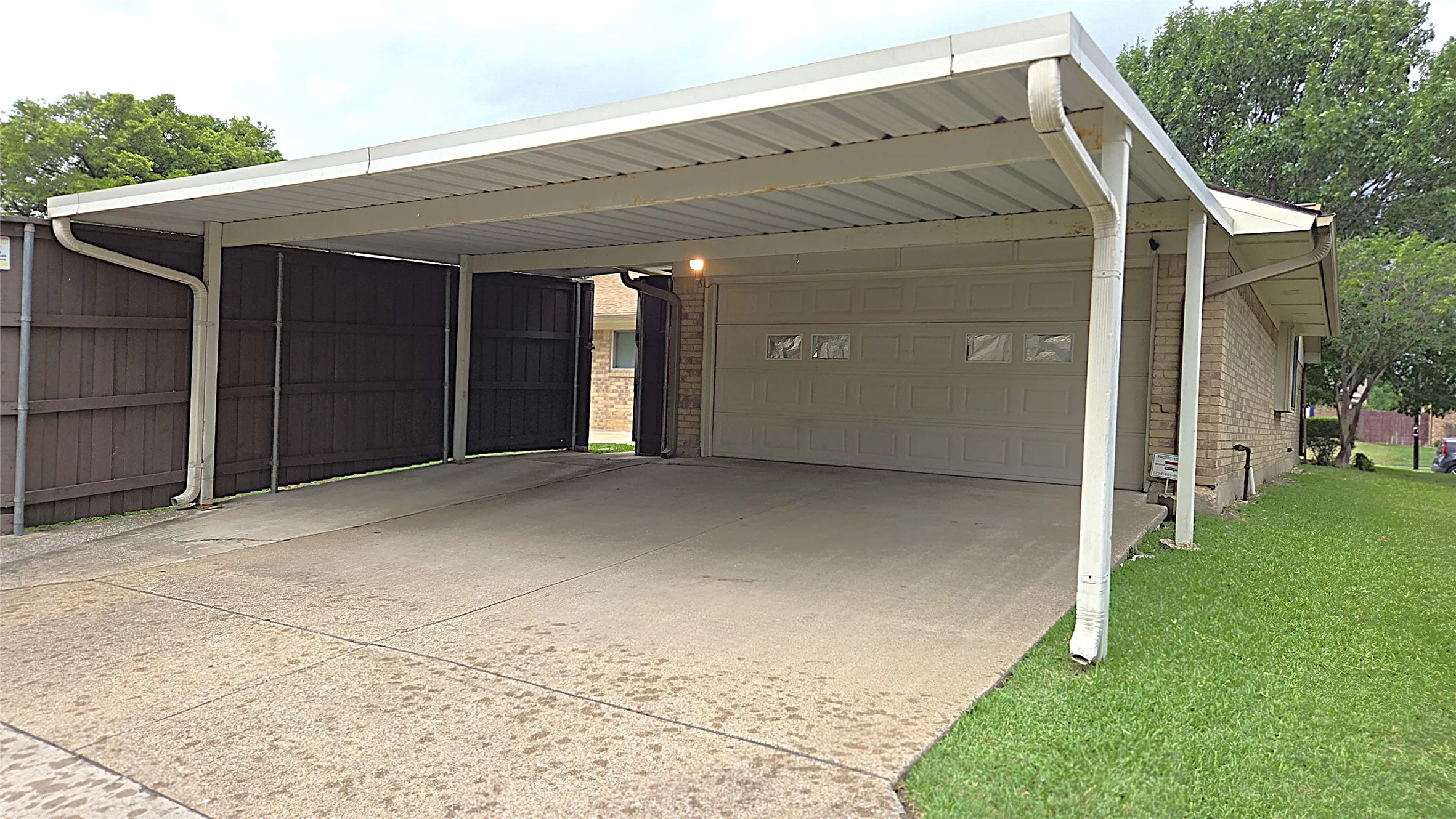 2-car attached garage and 25 x 21 metal carport at back of home.