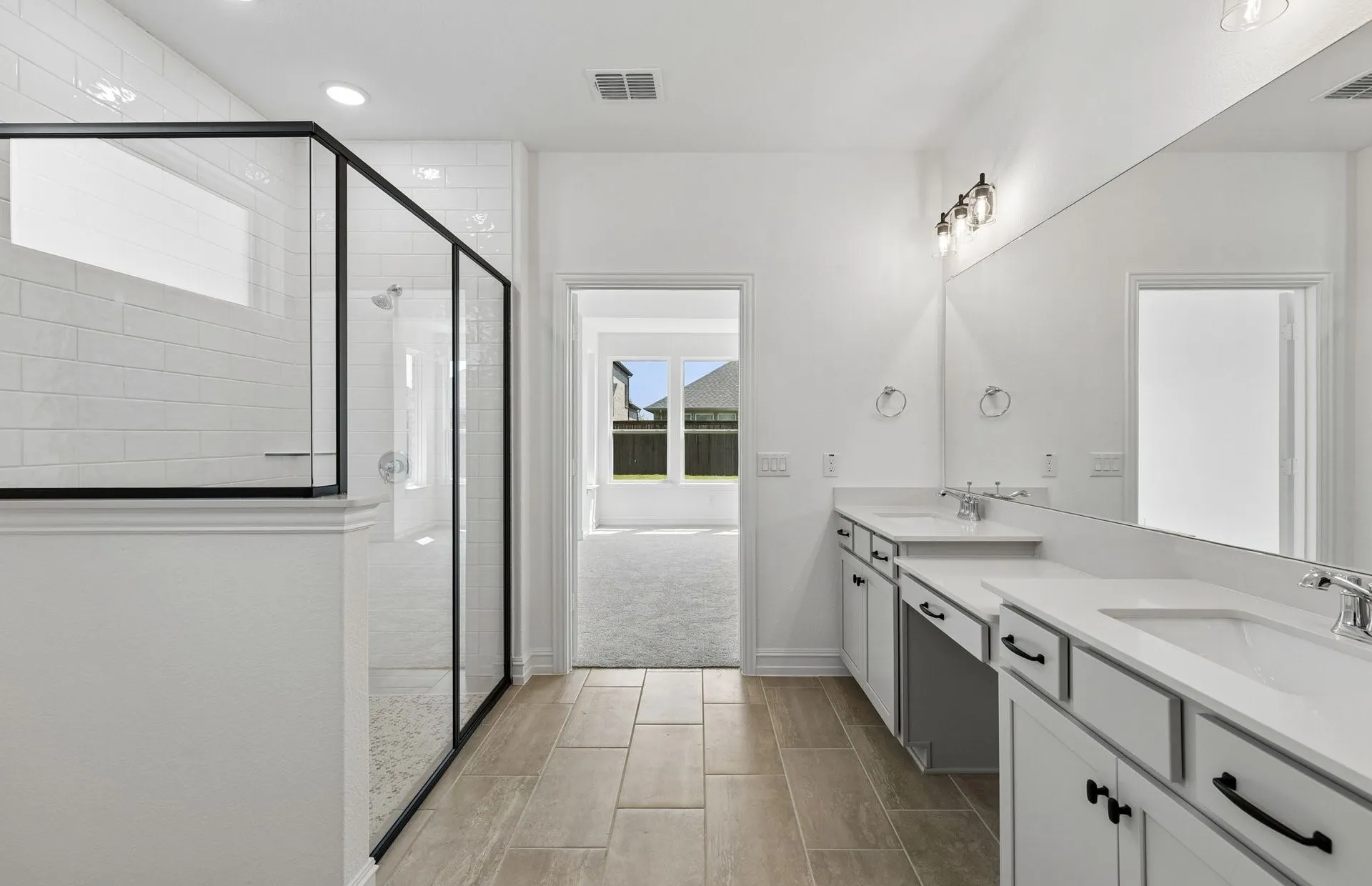 Separate tub and shower in owners bath