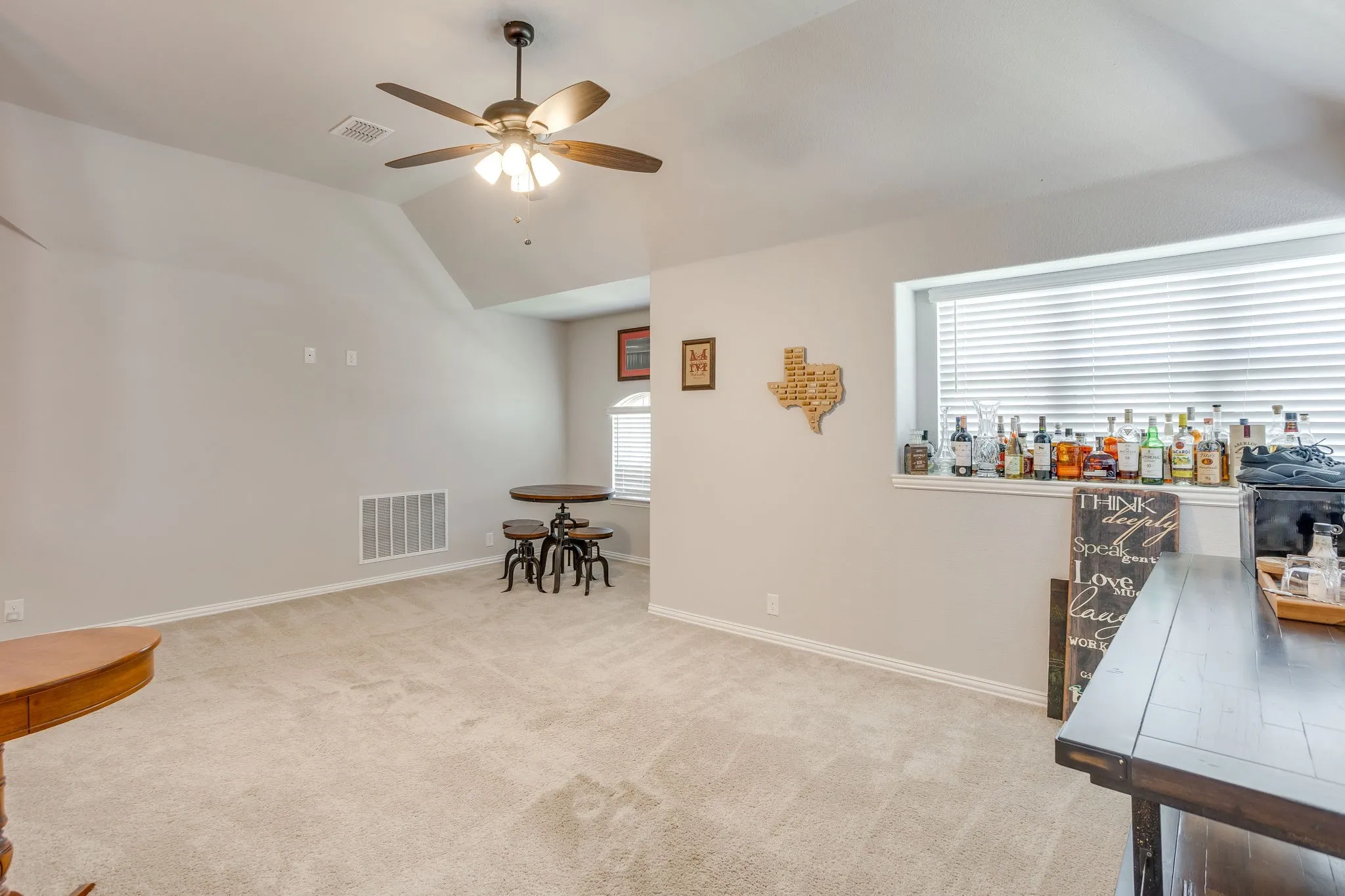 Family room featuring neutral tone carpet.