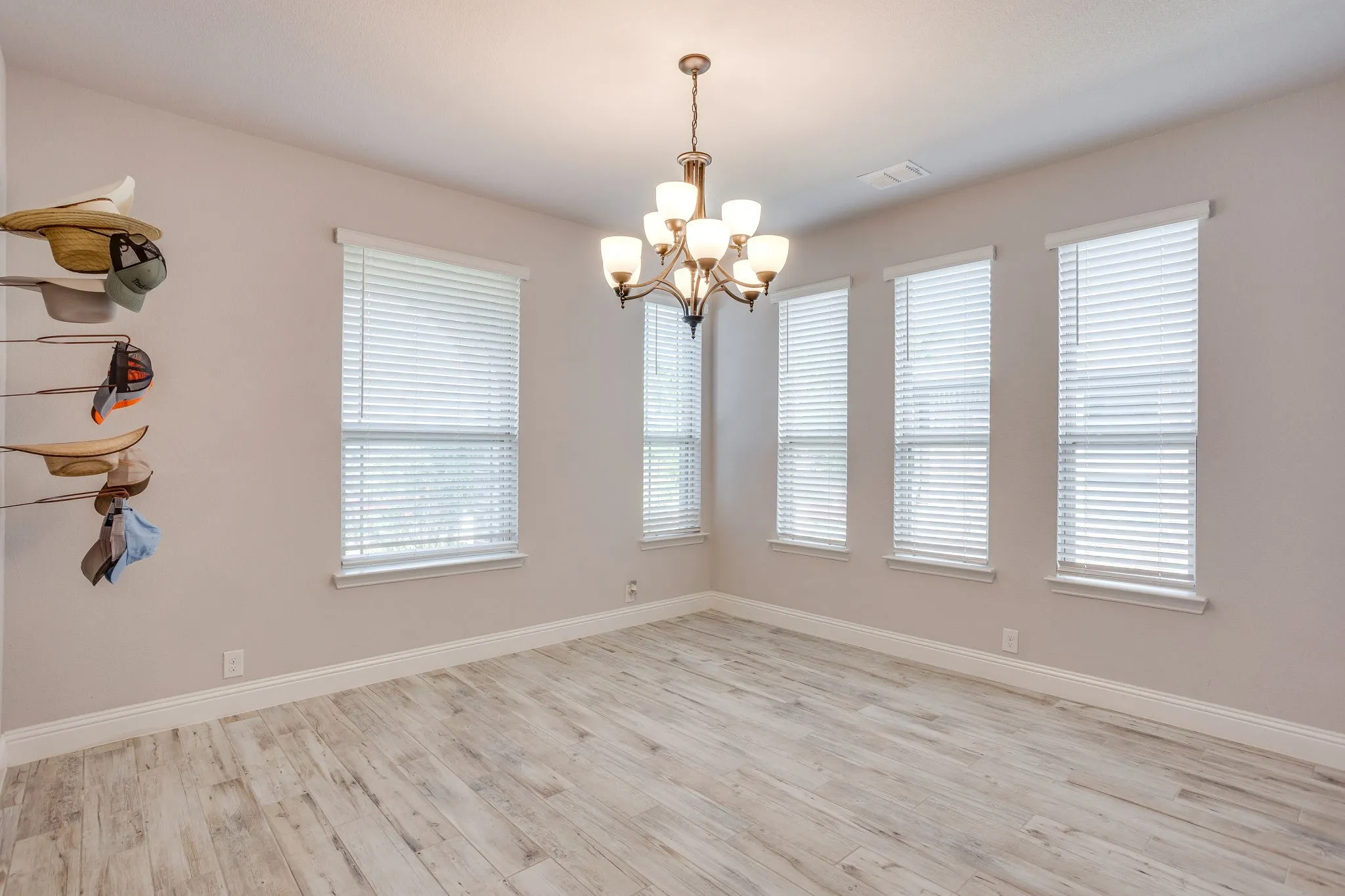 Dining room featuring decorative lighting and 5 windows for ample lighting