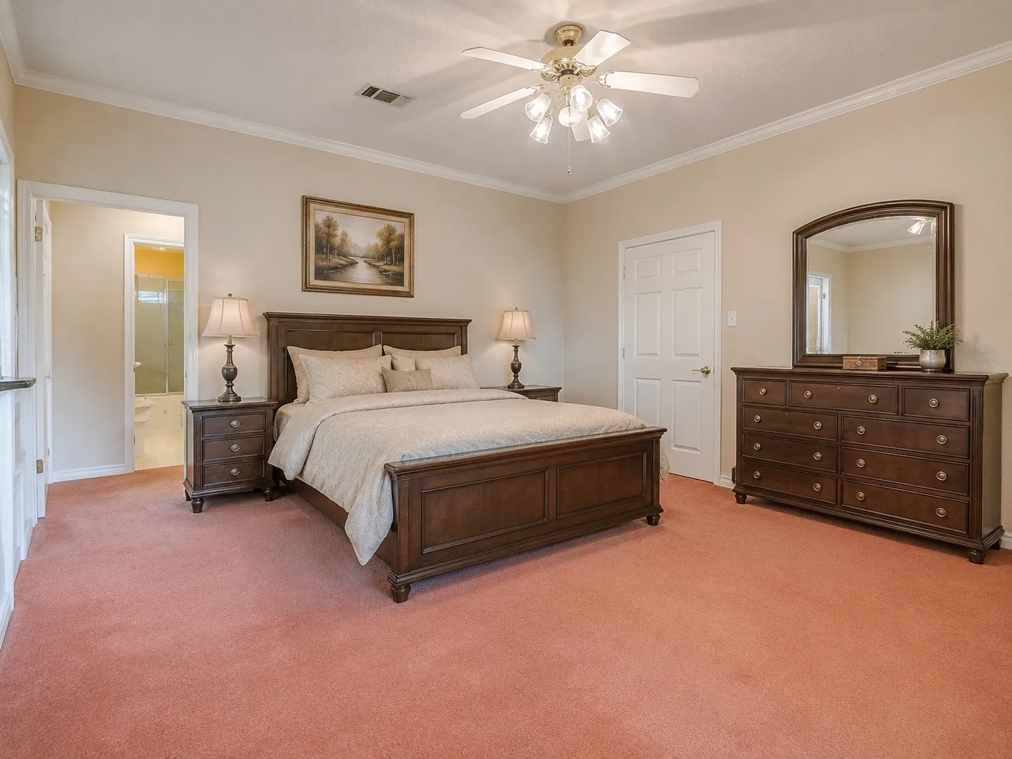 Spacious room featuring neutral-toned walls and crown molding Photo is virtually staged.