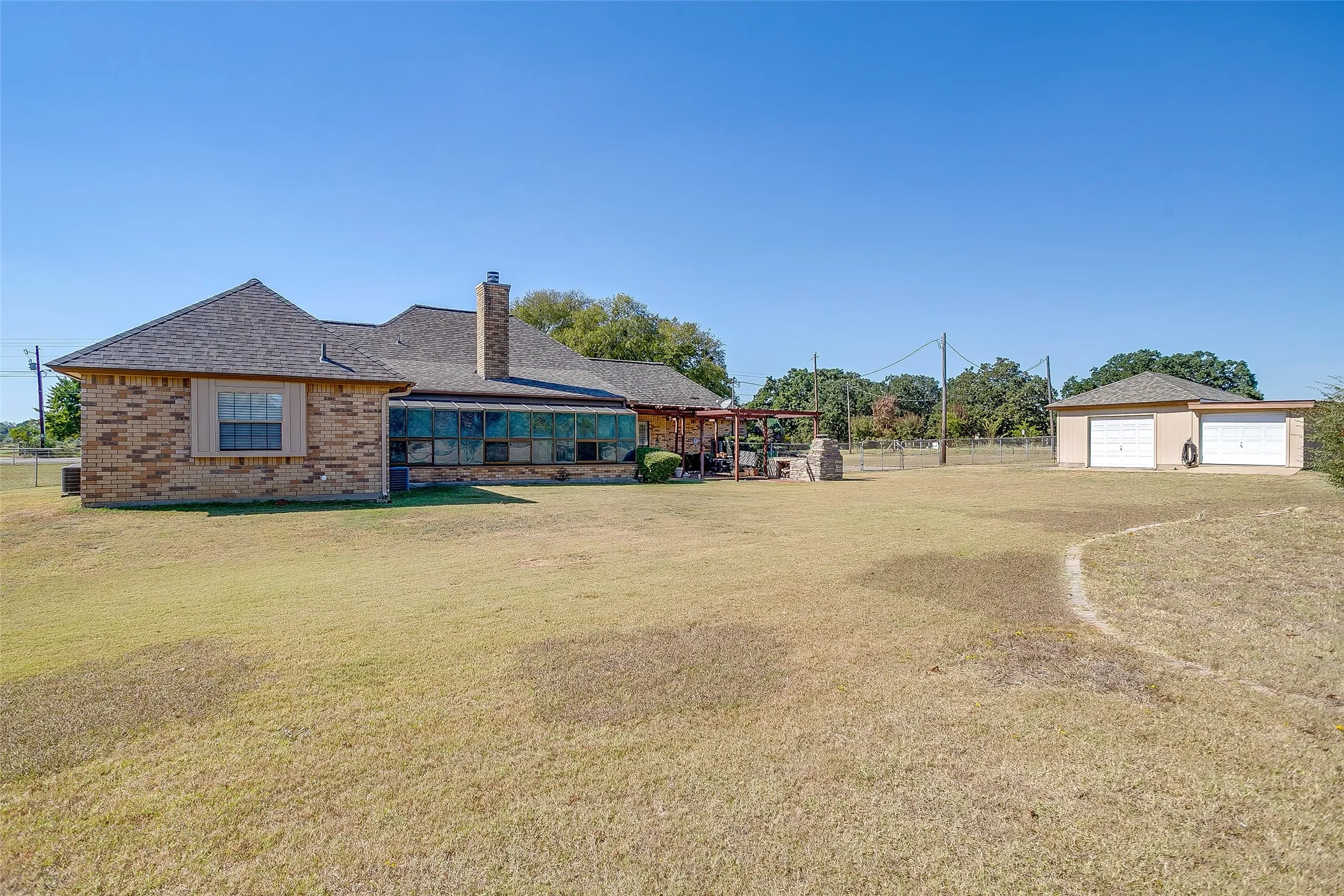 Large back yard with a workshop.