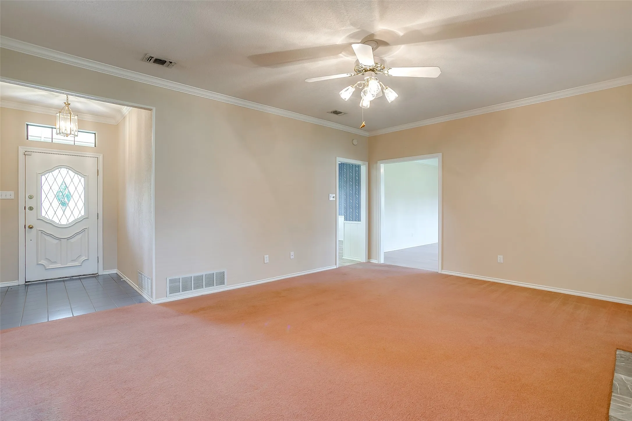 living room with view of front door,.