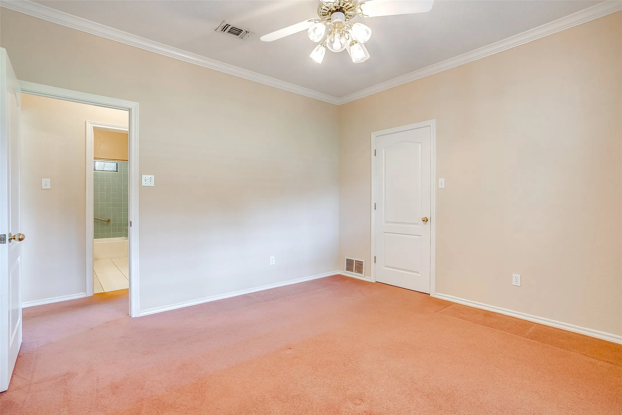 Bedroom #2 is spacious room featuring carpeting, light neutral wall tones, white trim, and a ceiling fan with integrated lighting
