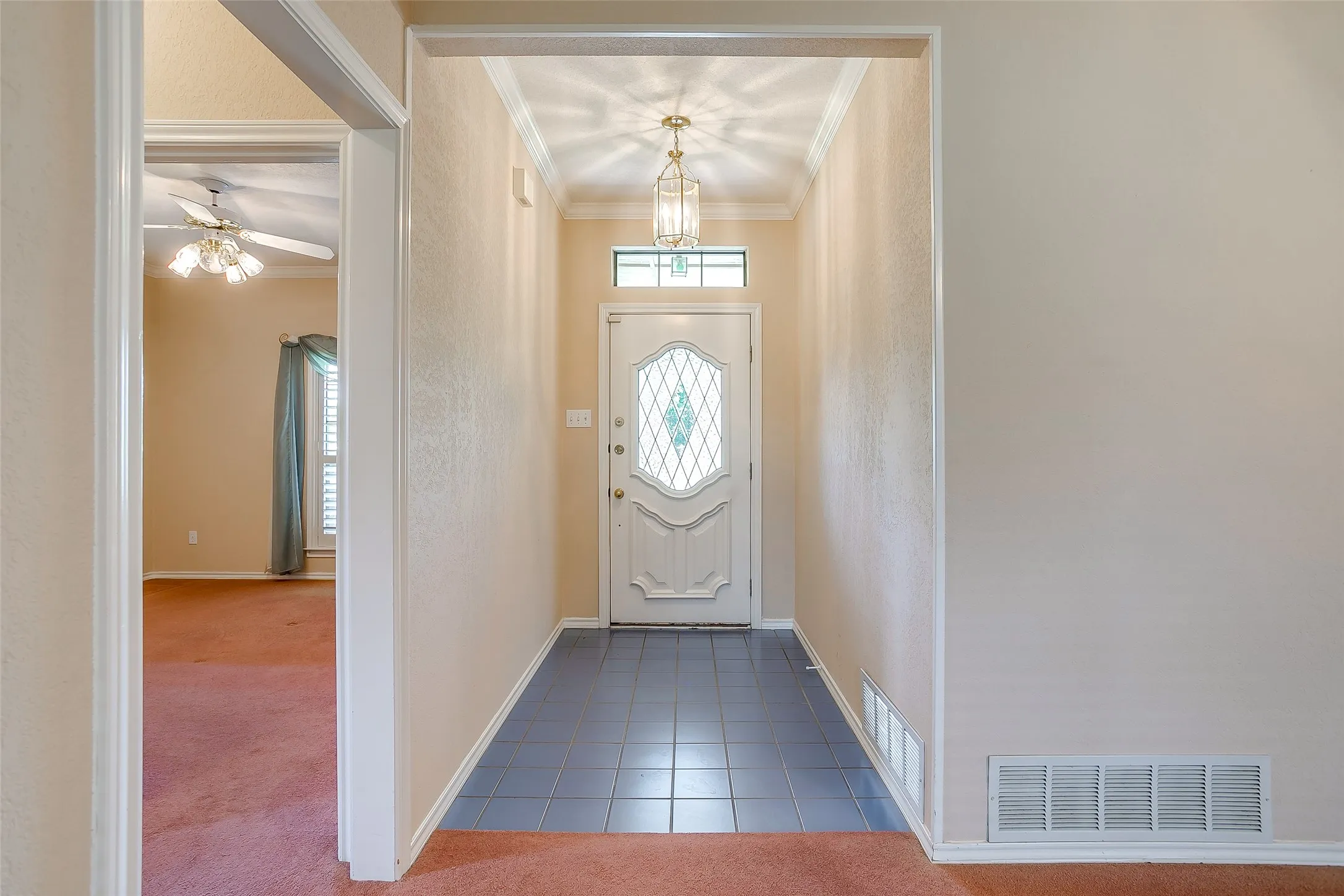 living room with view of front door,.