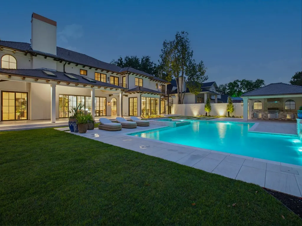 Resort-style backyard with elegant pool, spa, cabana, lots of grassy areas all encompassed by a gorgeous German-Schmeared brick wall for extra privacy!