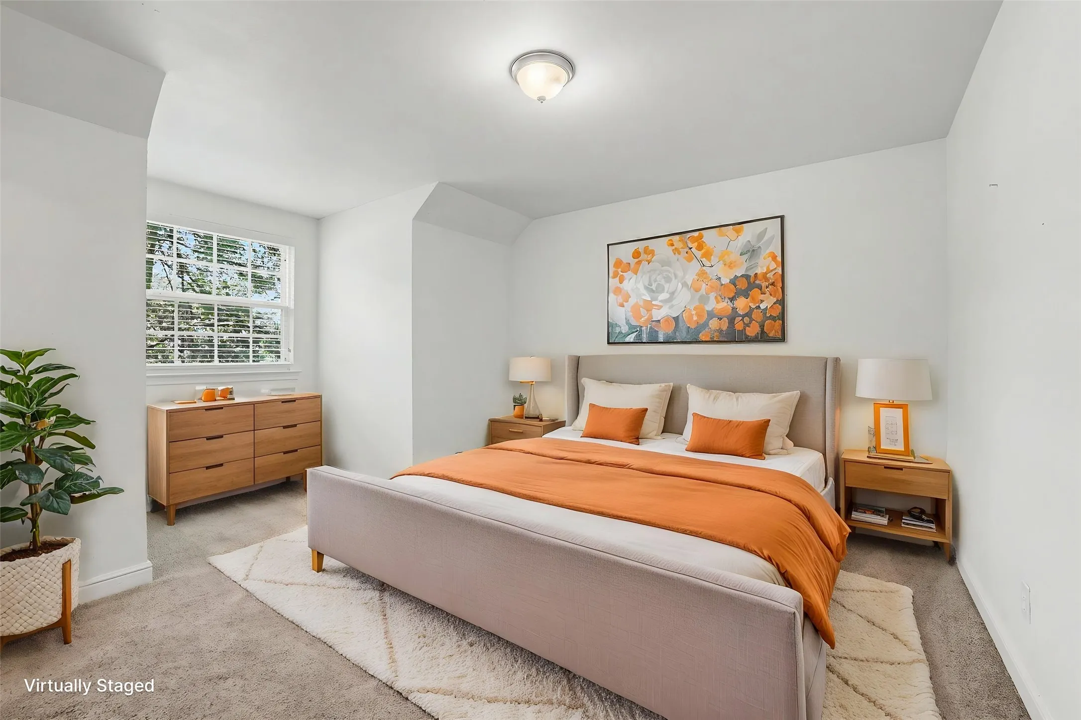 Upstairs bedroom with a multi-pane window, flush-mount ceiling light, and white wall finishes.