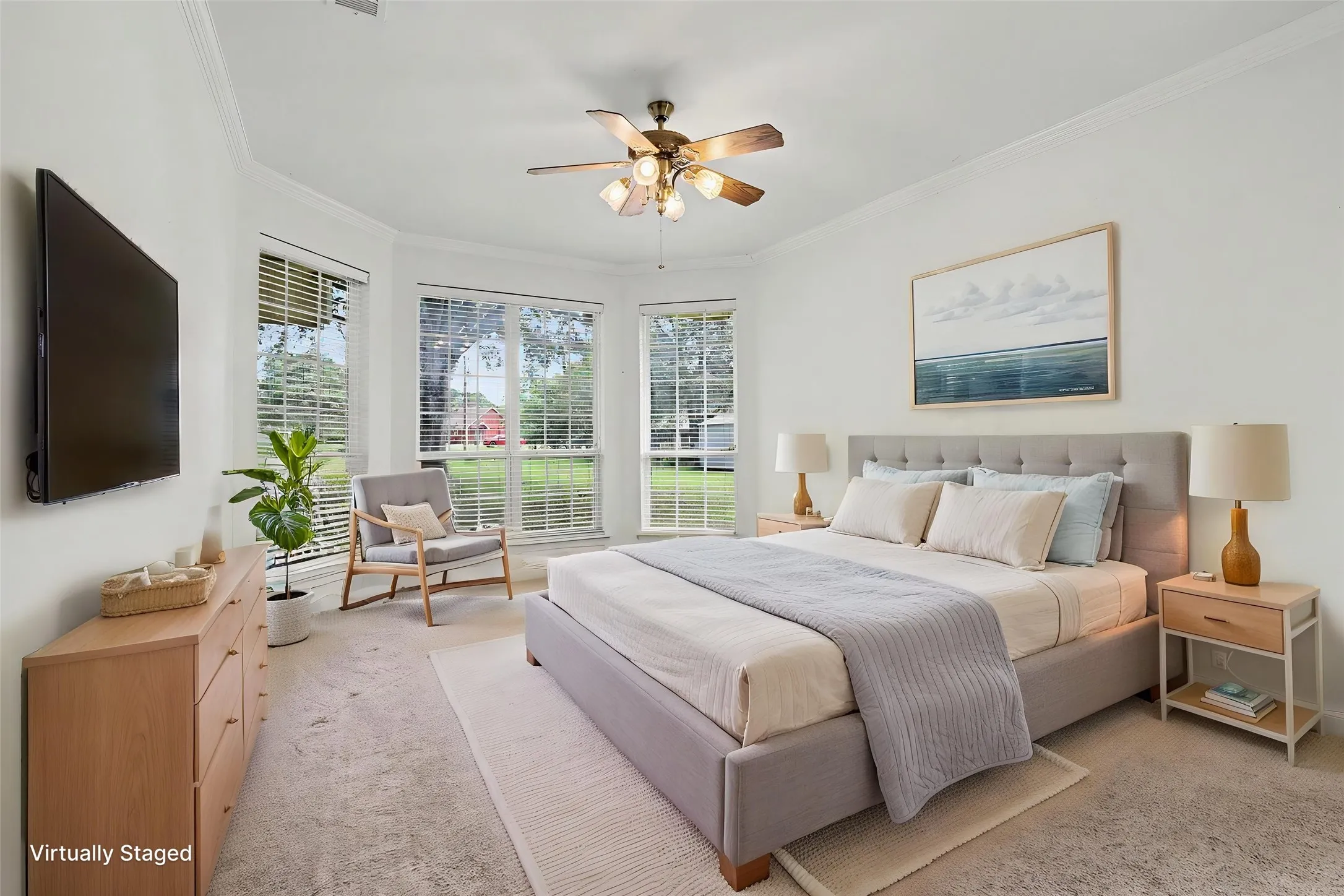 Carpeted interior with crown molding and a bay window featuring horizontal blinds.