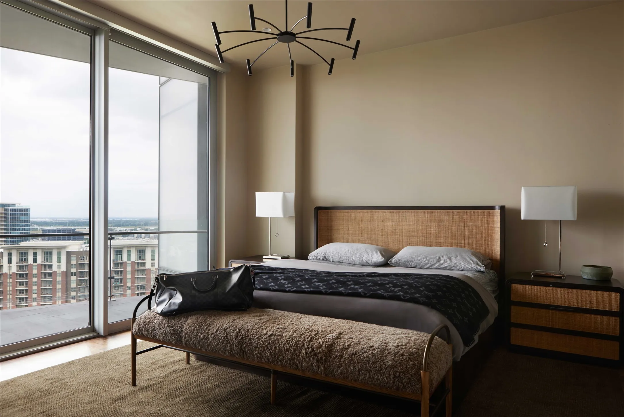 Floor-to-ceiling sliding glass doors provide natural light