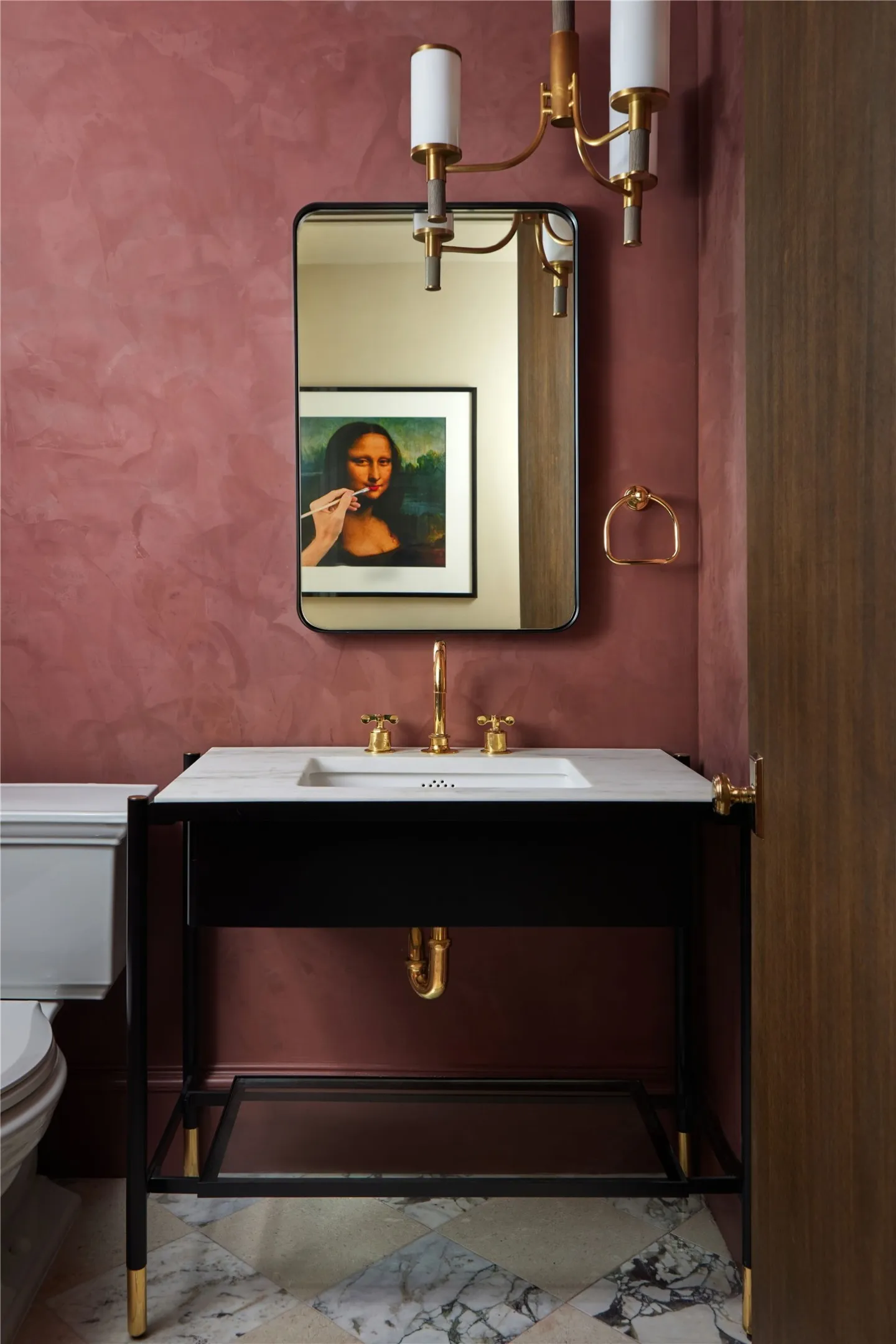 Vanity featuring a white countertop with an integrated rectangular sink, gold-tone faucet, and a black open-shelf base with a glass bottom shelf