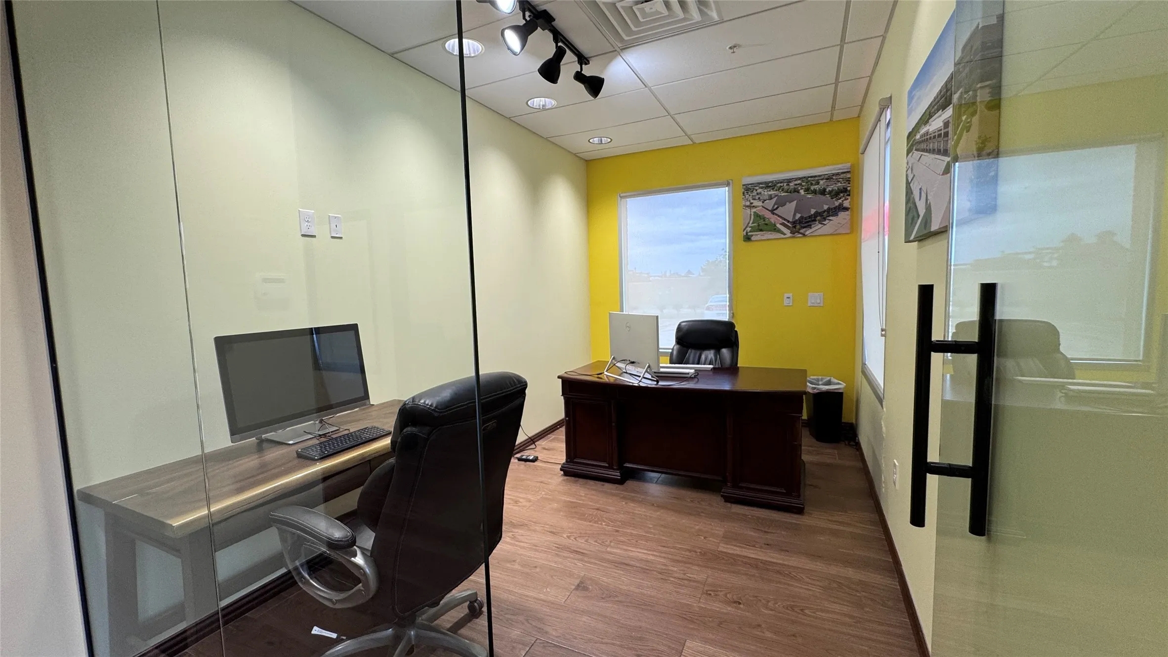 Large office with glass doors, comfortable for two staff