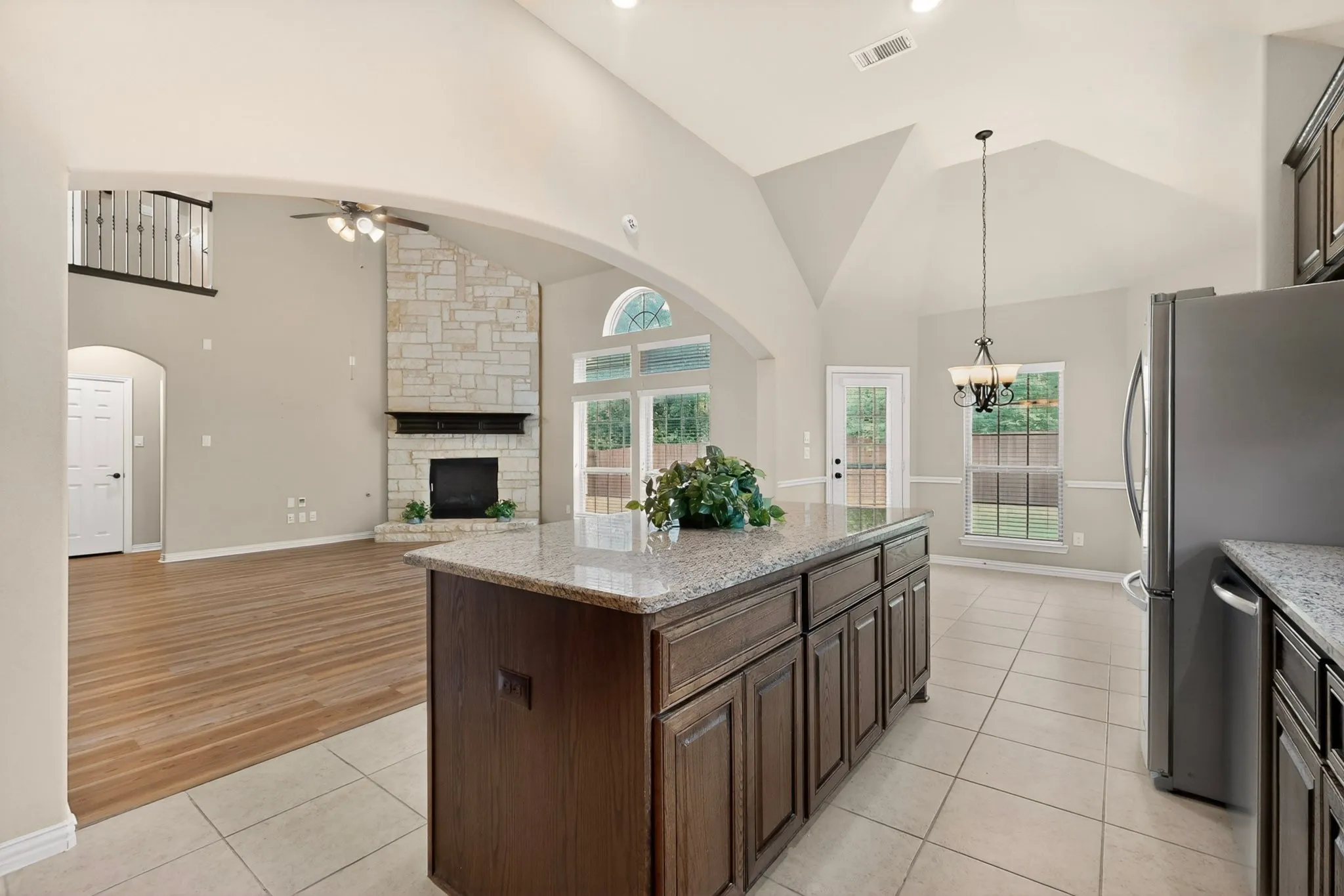 BAR ISLAND THAT LOOKS INTO THE FAMILY ROOM SO THAT YOU WILL NEVER MISS A MINUTE OF YOUR BEST MOVIE OR THE BIG GAME...!!!