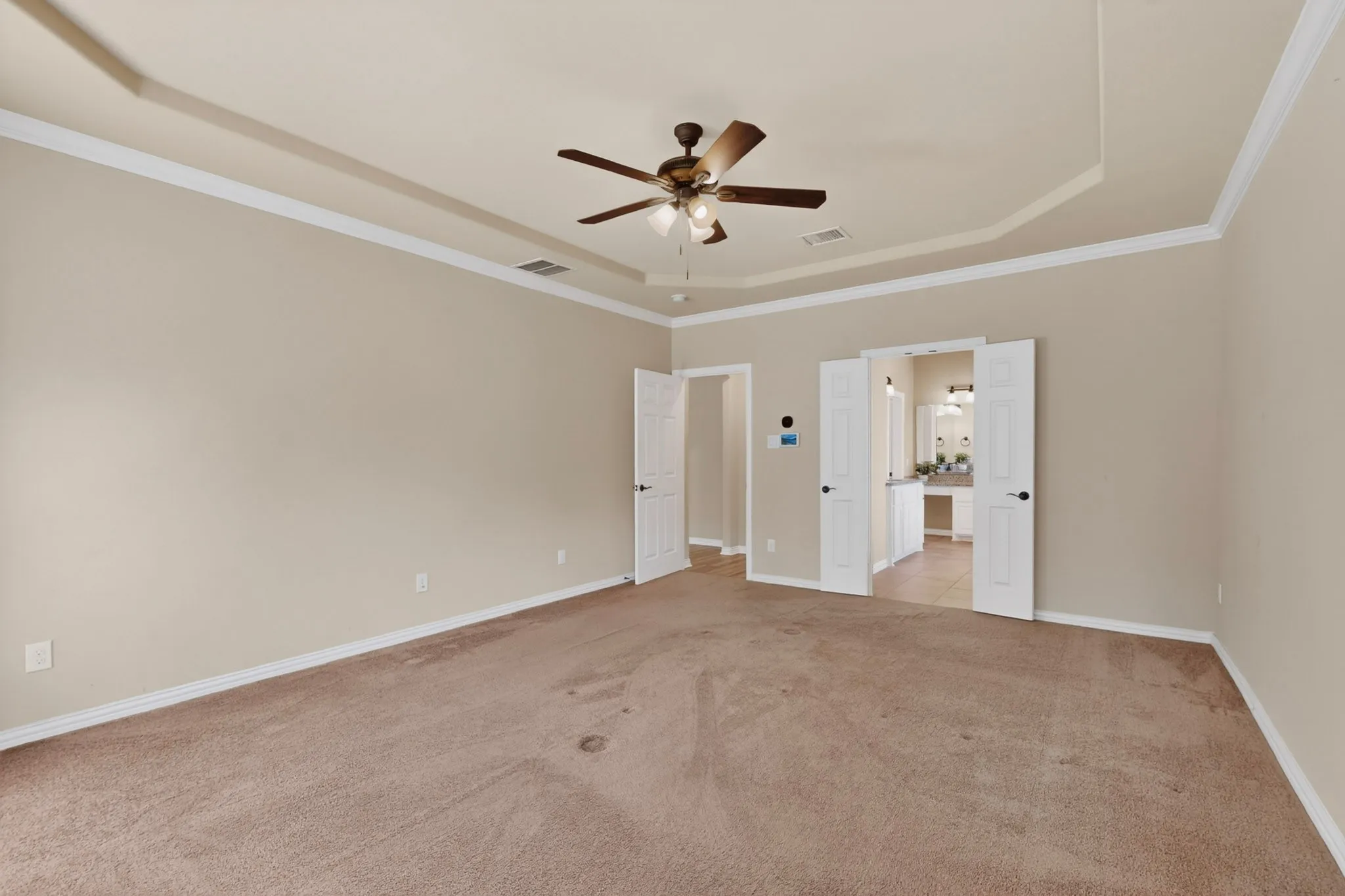 MASTER BEDROOM WITH SPACE FOR A SITTING AREA AND A VIEW INTO THE GORGEOUS MASTER BATH...