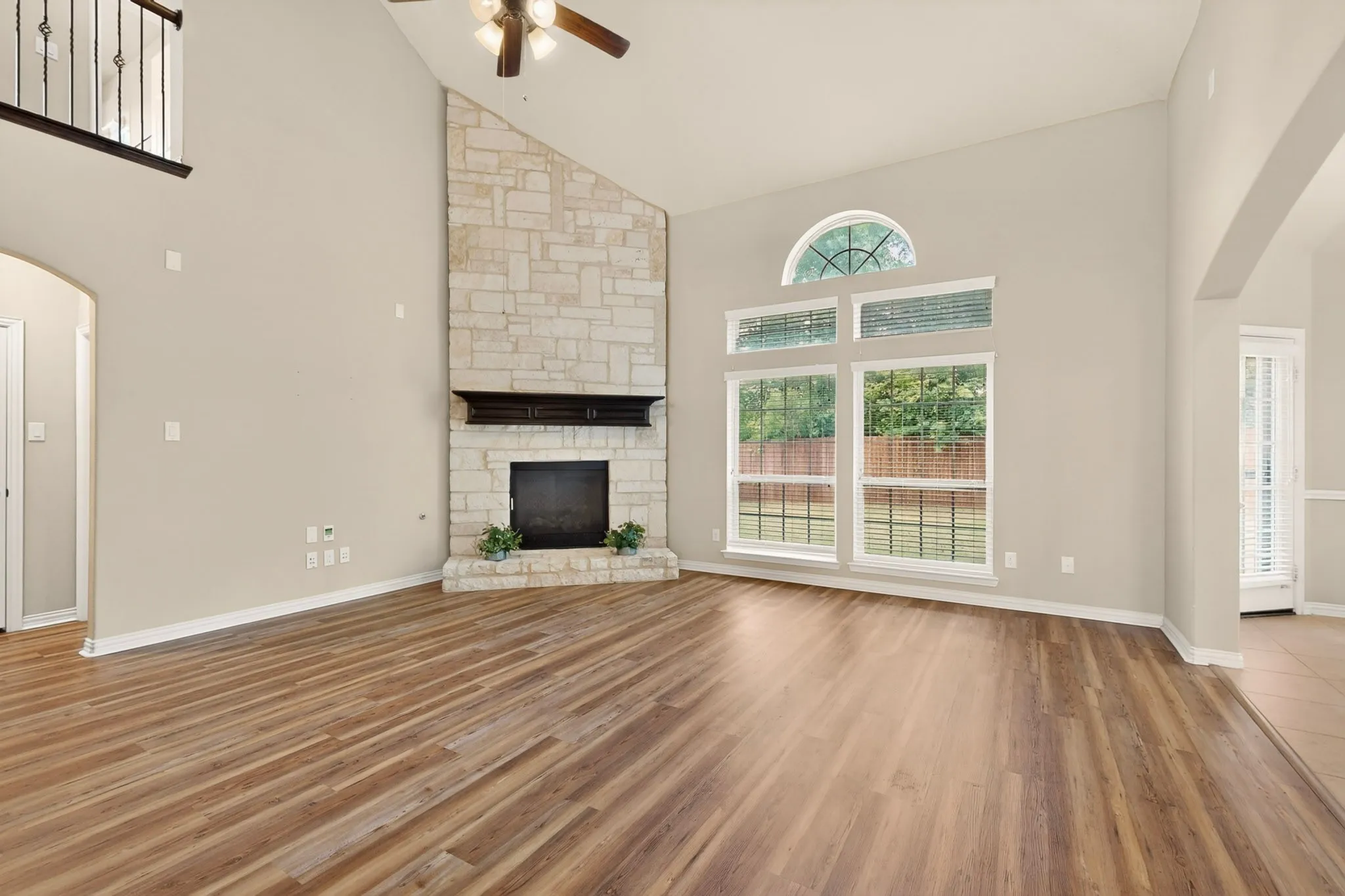ANOTHER LOOK INTO THE FAMILY ROOM WITH DOUBLE WINDOWS THAT USHERS IN LOTS OF NATURAL LIGHT WITH A VIEW OF THE BACKYARD.