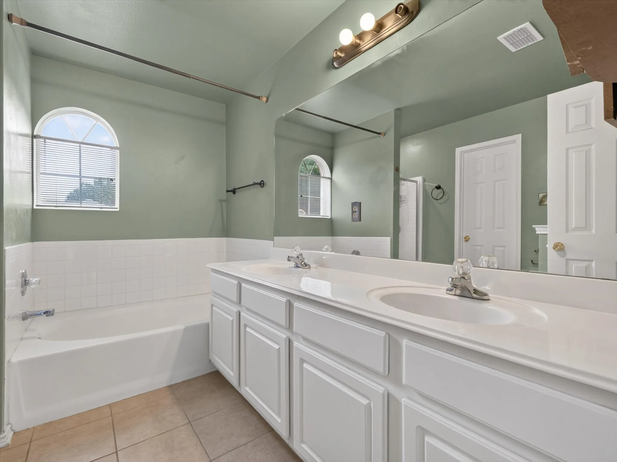 Primary Bathroom with Dual Sinks, Garden Tub, and Walk In shower