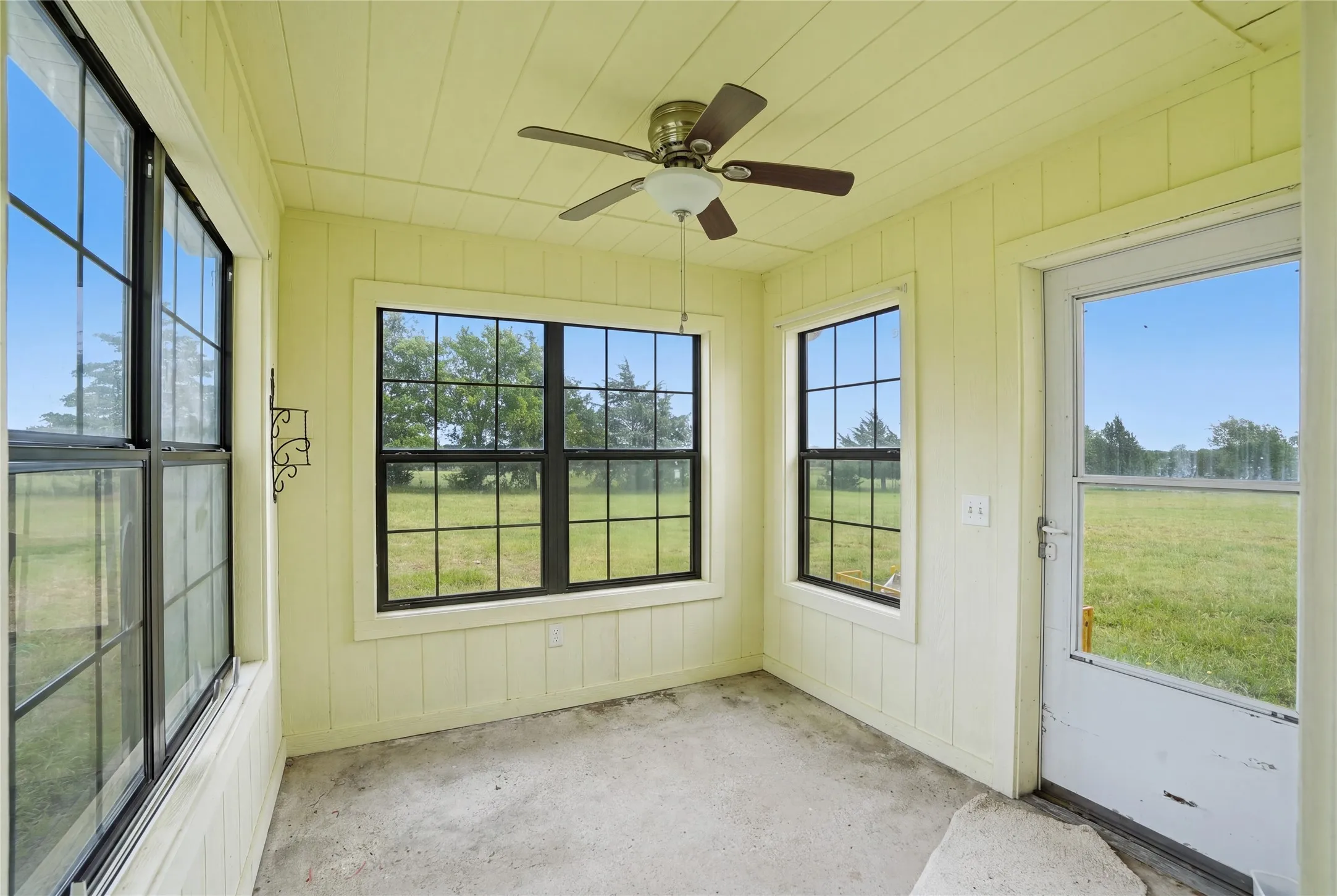 Bright sunroom filled with natural light, offering a peaceful space to relax and enjoy outdoor views year-round