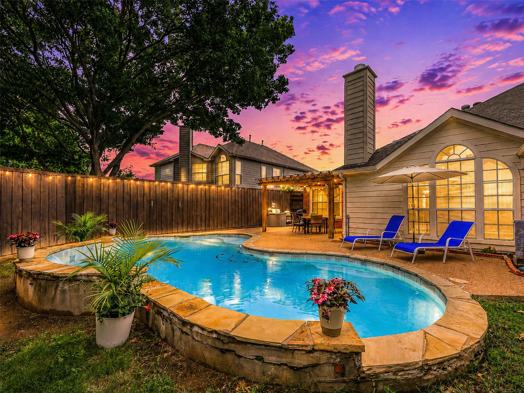  Step outside to a backyard designed for entertaining with a covered pergola, string lighting, and ample patio space overlooking the sparkling pool. The perfect setting for outdoor dining, relaxing, or hosting summer gatherings.