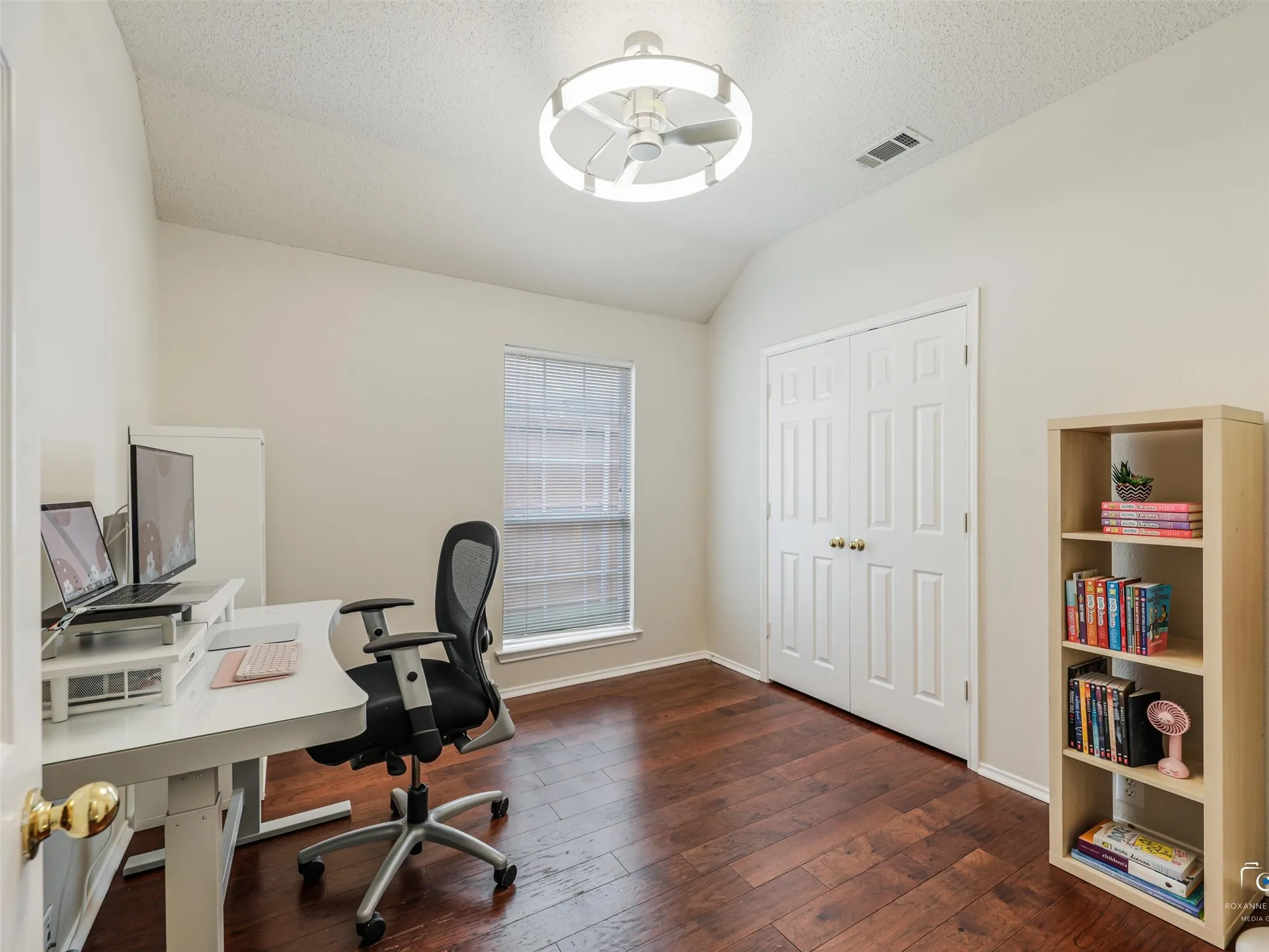 This versatile secondary bedroom features rich hardwood flooring, generous closet space, and plenty of natural light. Ideal for guests, a home office, or a growing family.