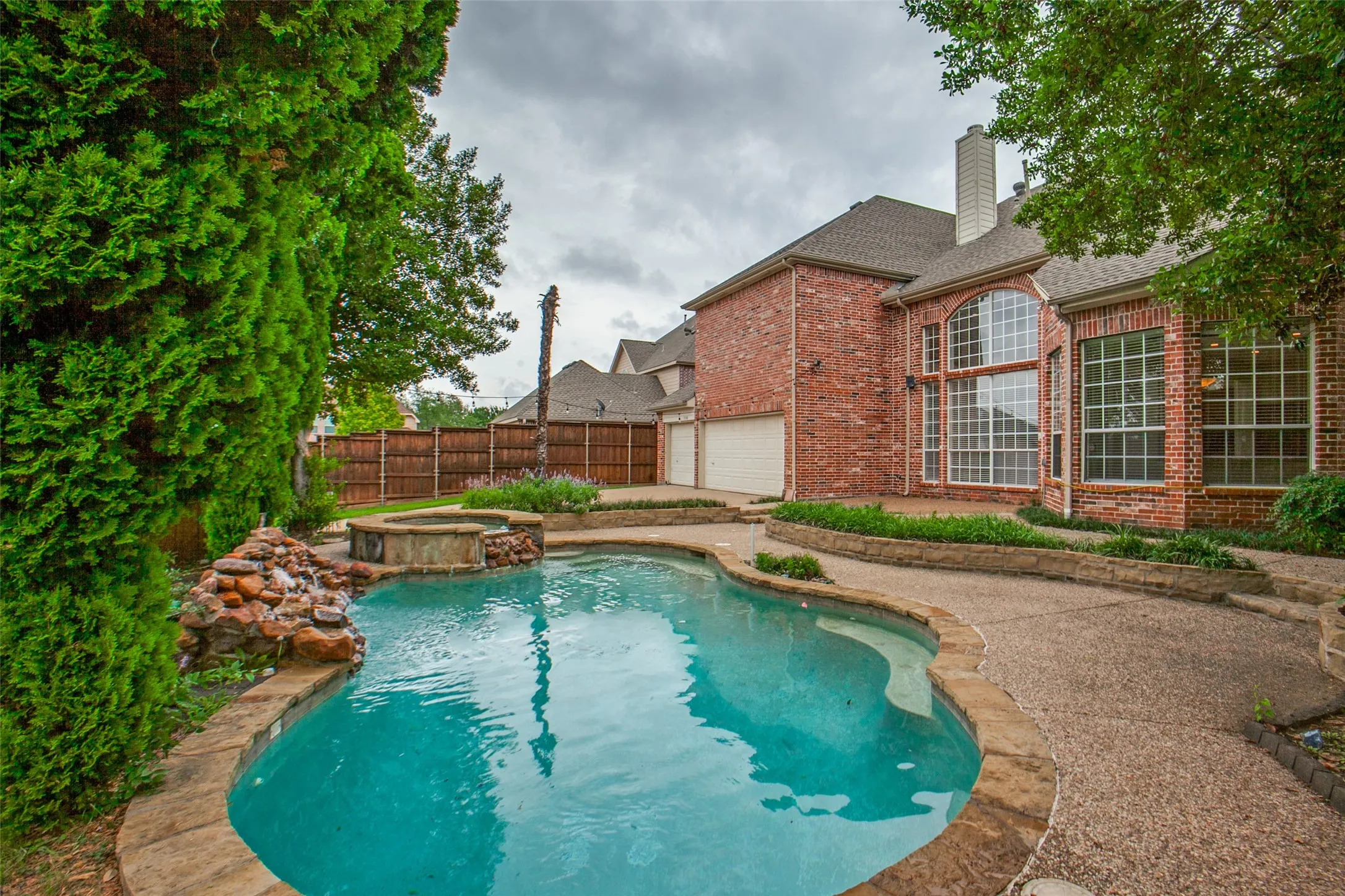 Large Backyard area opens to gated driveway and 3 car garage