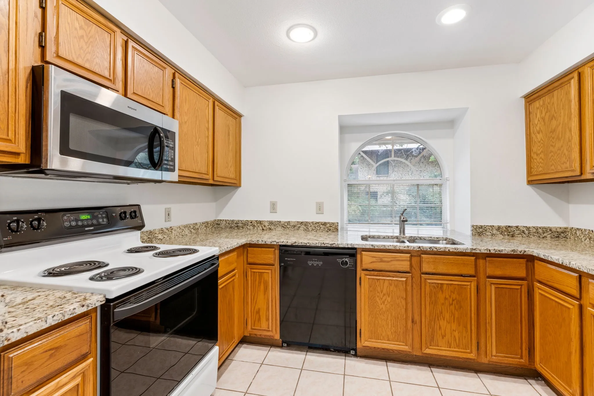 Kitchen open to living room. Granite counter tops and under mount sink.