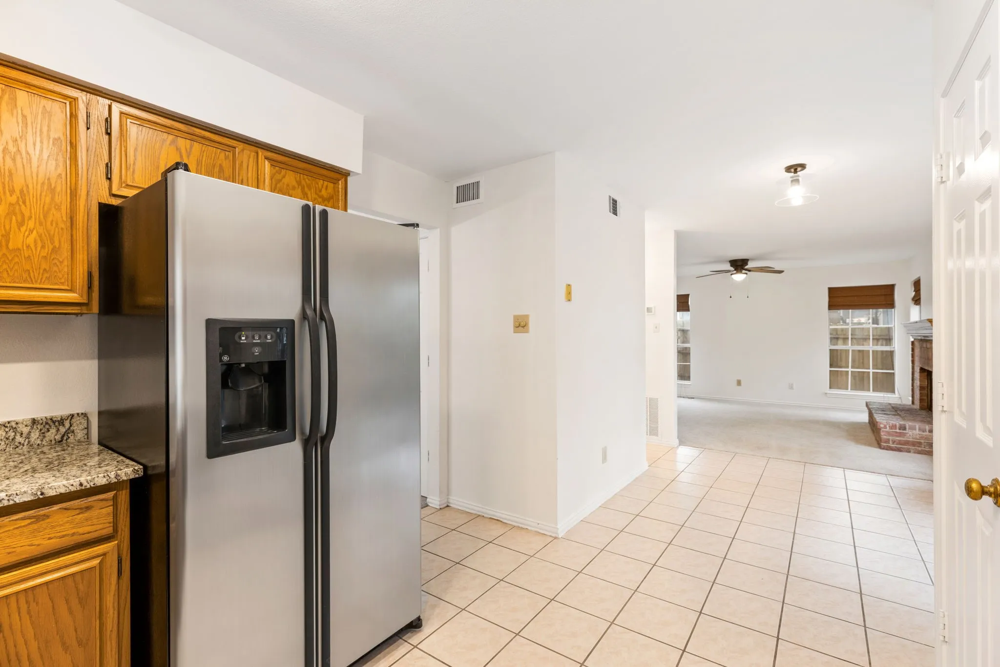 Kitchen open to living room. Granite counter tops and under mount sink.
