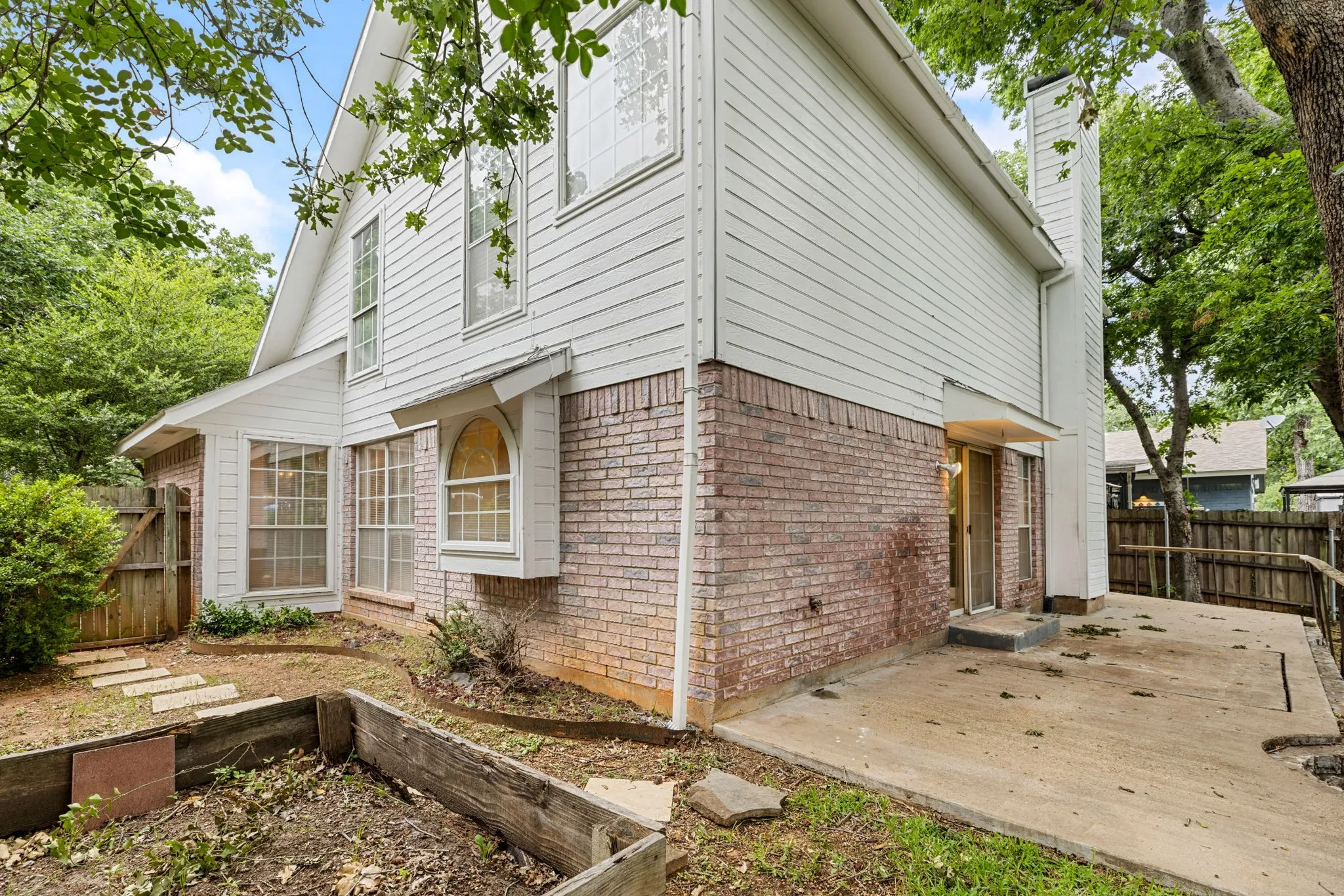Expansive backyard patio and garden bed