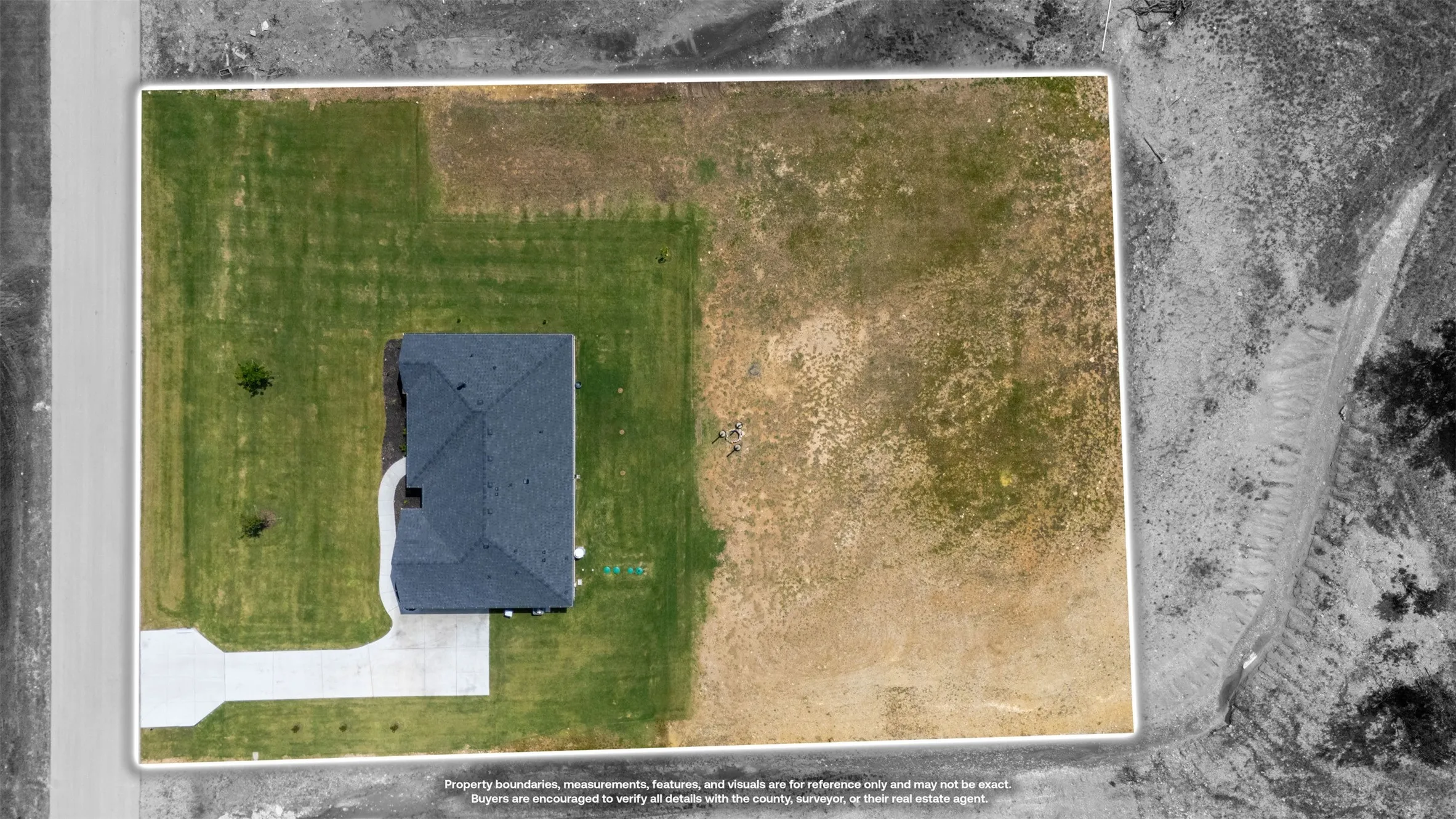 Aerial view showcasing a detached property with a dark shingle roof and a concrete driveway