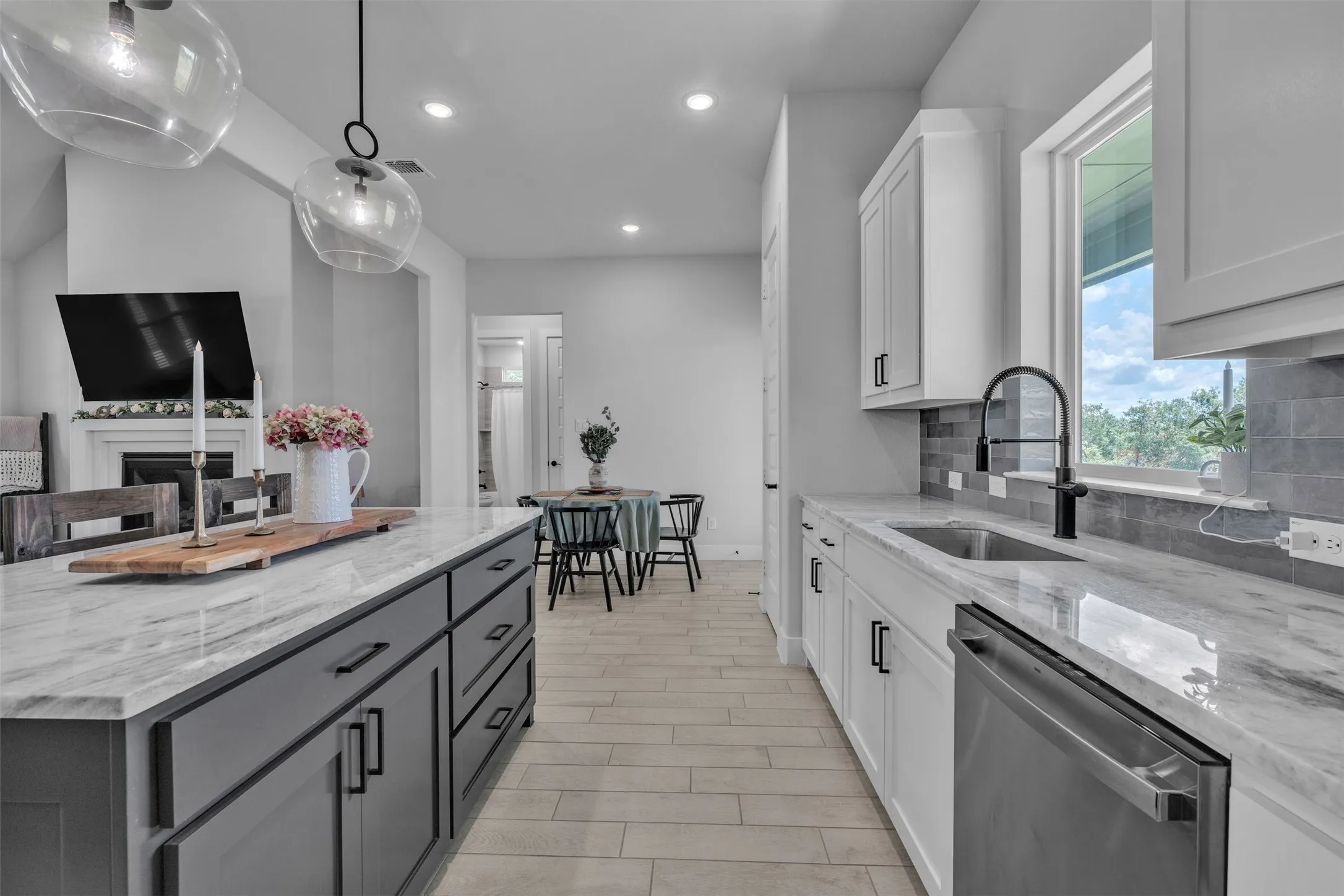 Neutral wall colors complement the light wood-finish flooring