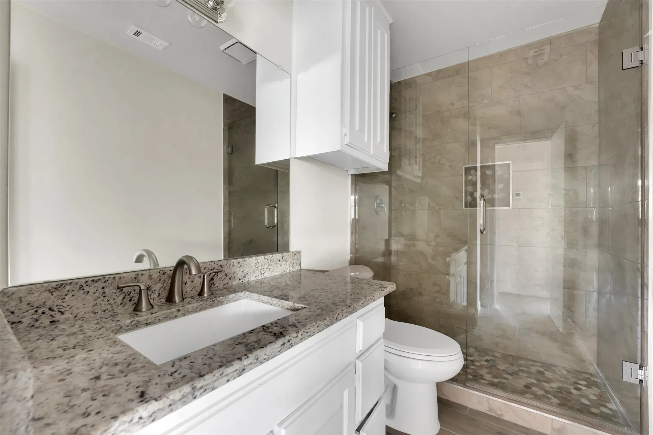 Full bathroom featuring vanity and a stall shower