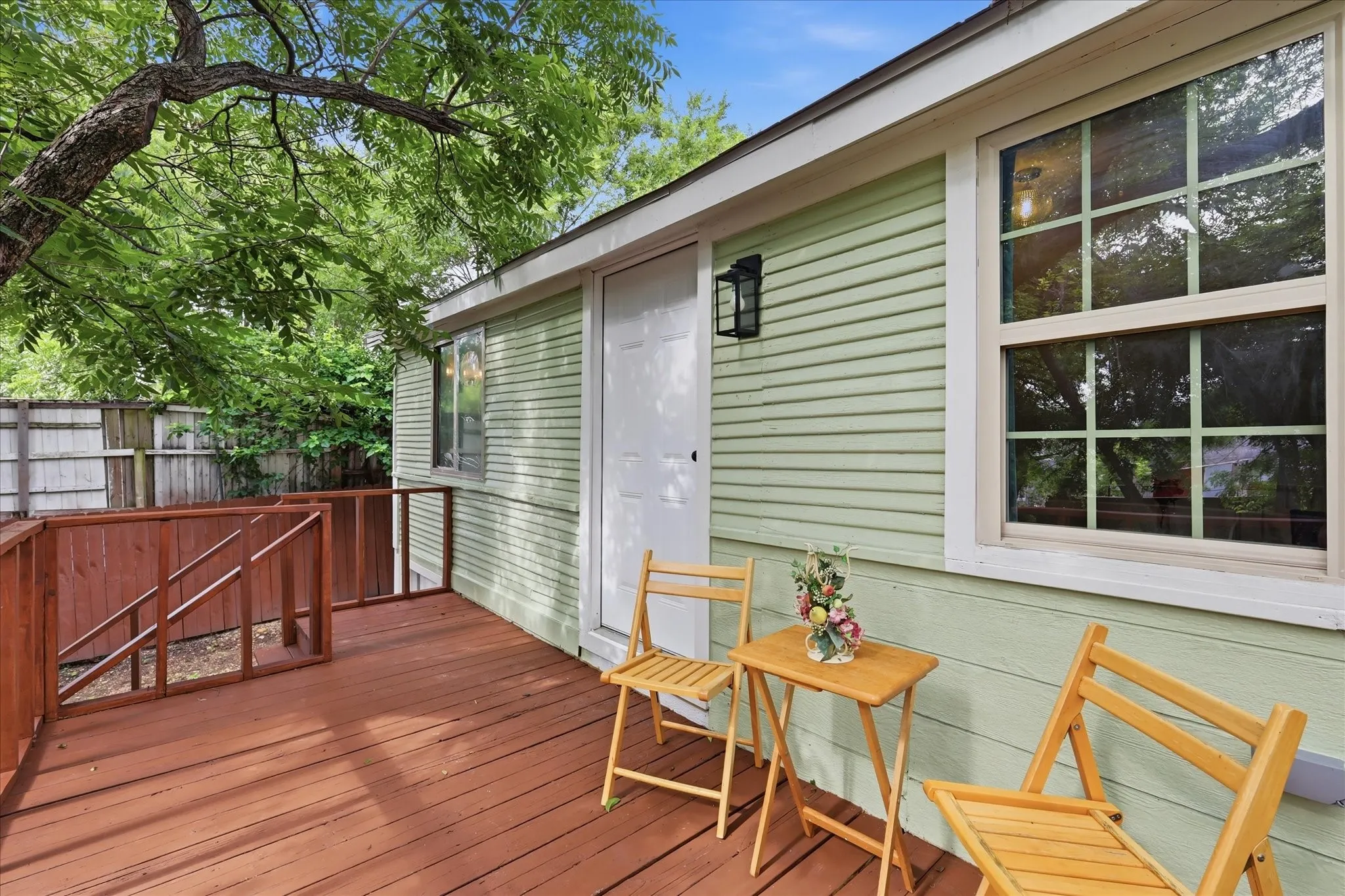 Expansive outdoor deck with rich wood-finish flooring