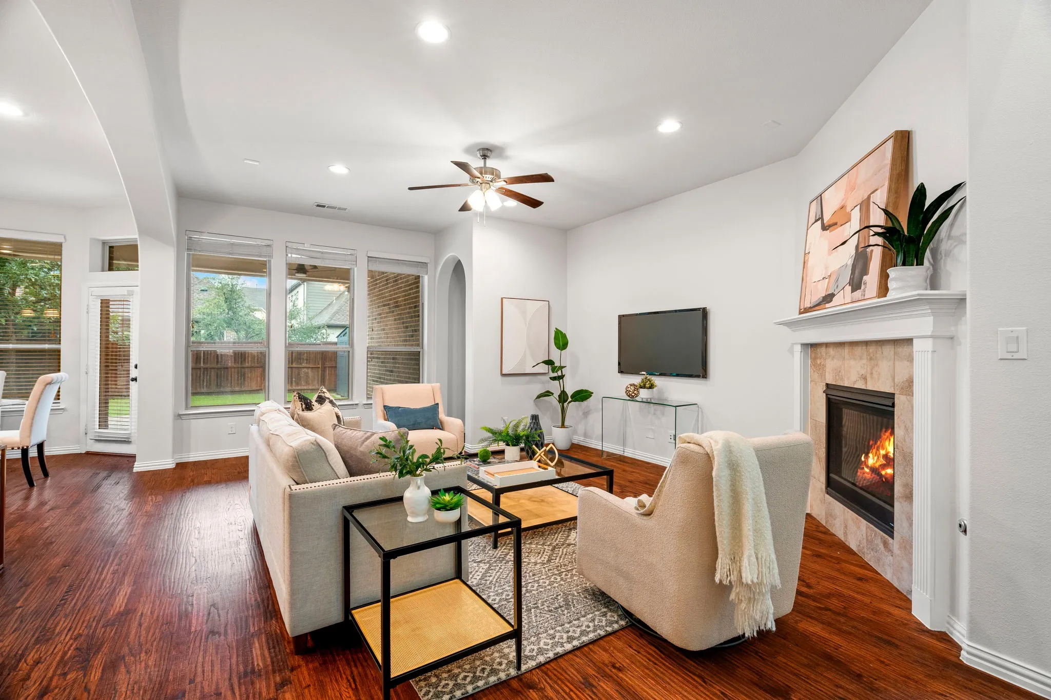 Featuring hardwood floors, a classic fireplace, and fresh interior paint, the living room blends timeless charm with a clean, modern feel.