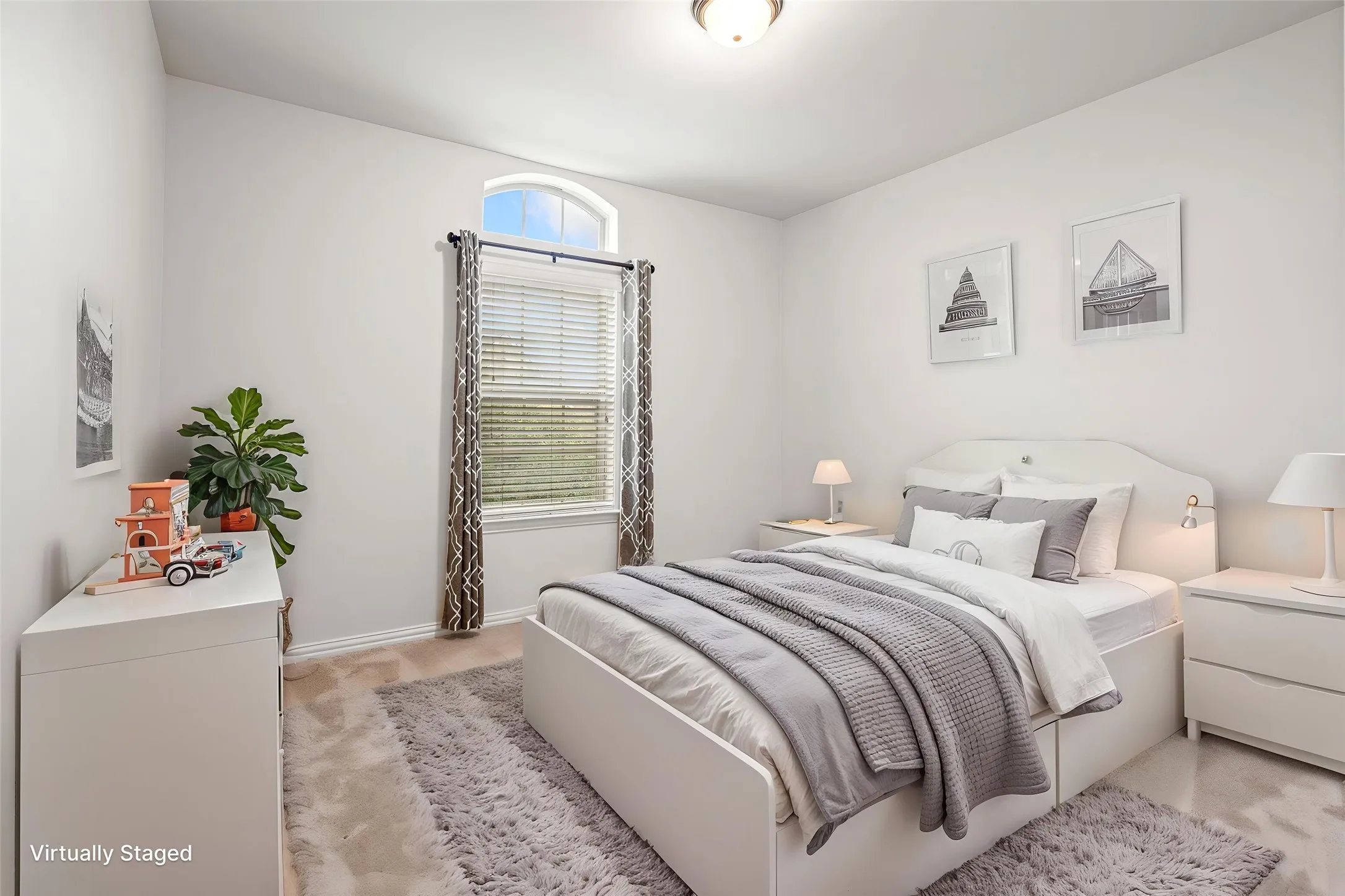 This upstairs bedroom features virtual staging, helping to envision the space as a warm and functional retreat for guests, family, or everyday living.