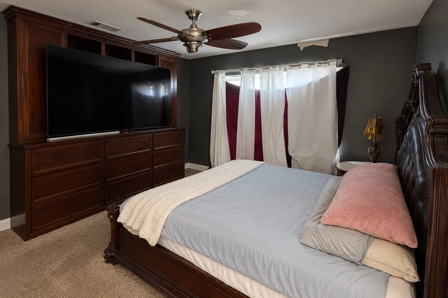 Built-in custom cabinetry with integrated media storage